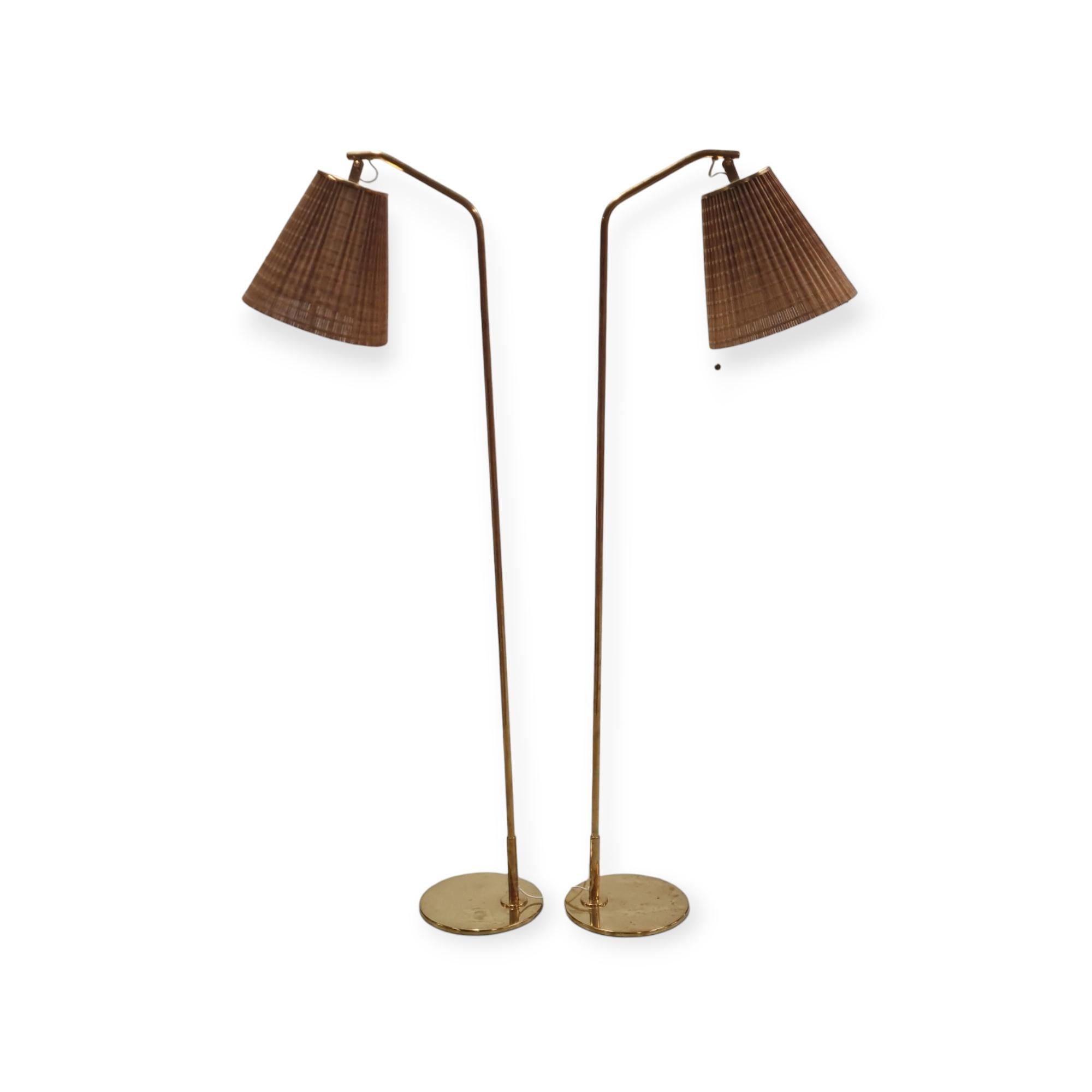 Brass Pair of Paavo Tynell Floor Lamps Model 9613 with Rattan Shades For Sale