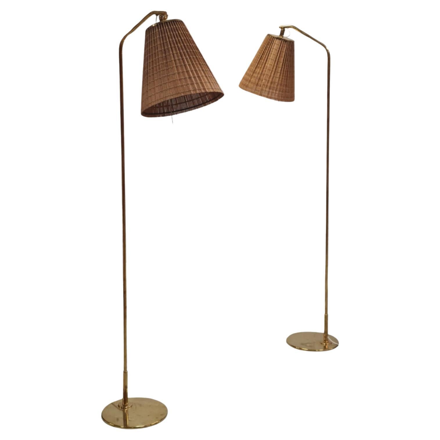 Pair of Paavo Tynell Floor Lamps Model 9613 with Rattan Shades For Sale