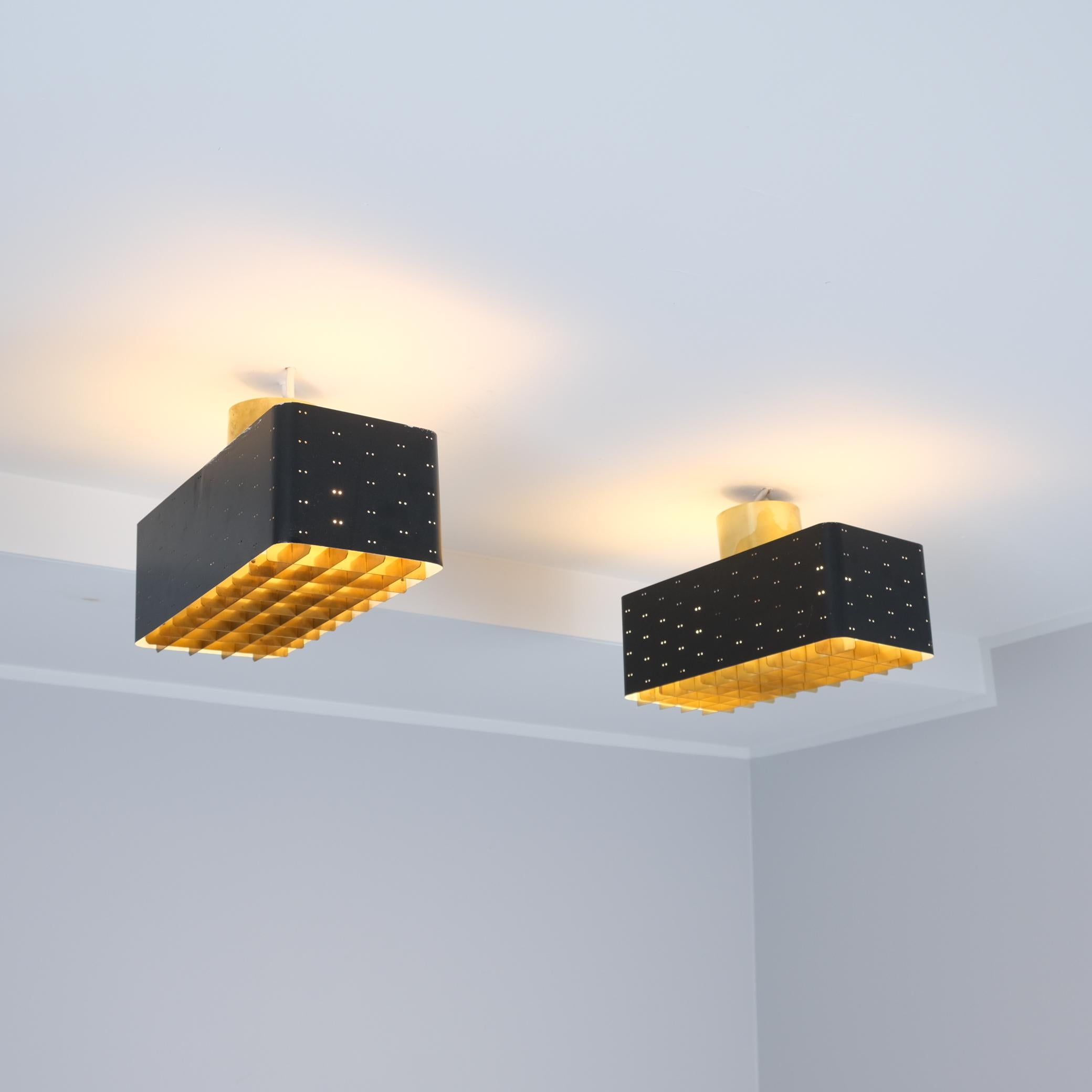 The Starry Sky is one of the most iconic designs of Paavo Tynell's lamps. It was made by both Taito and Idman in three different sizes. The way the light filters through the grill and the holes on the sides makes the ceiling look like a starry sky.