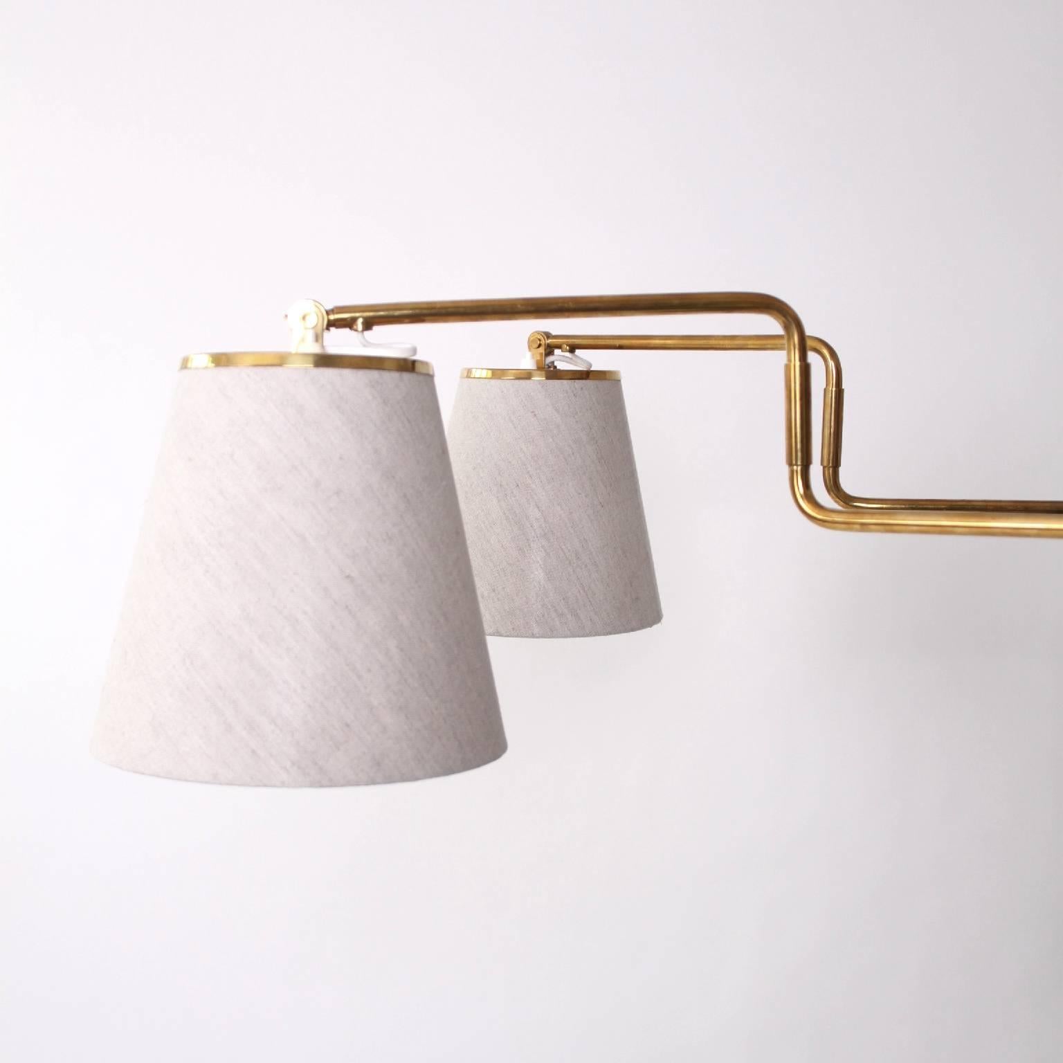 Danish Pair of Paavo Tynell Wall Lights in Brass and Fabric 1950s