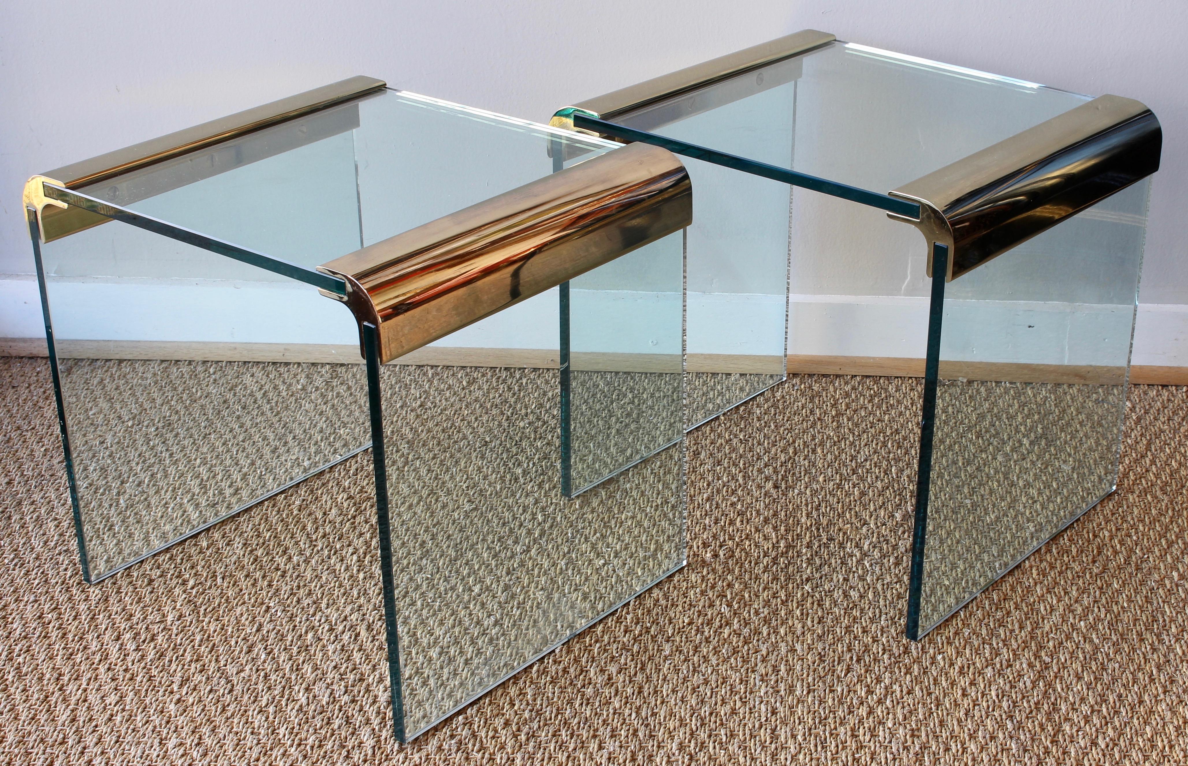 A pair of simple and elegant modern design brass and glass side or end tables designed by Leon Rosen for Pace Furniture.
