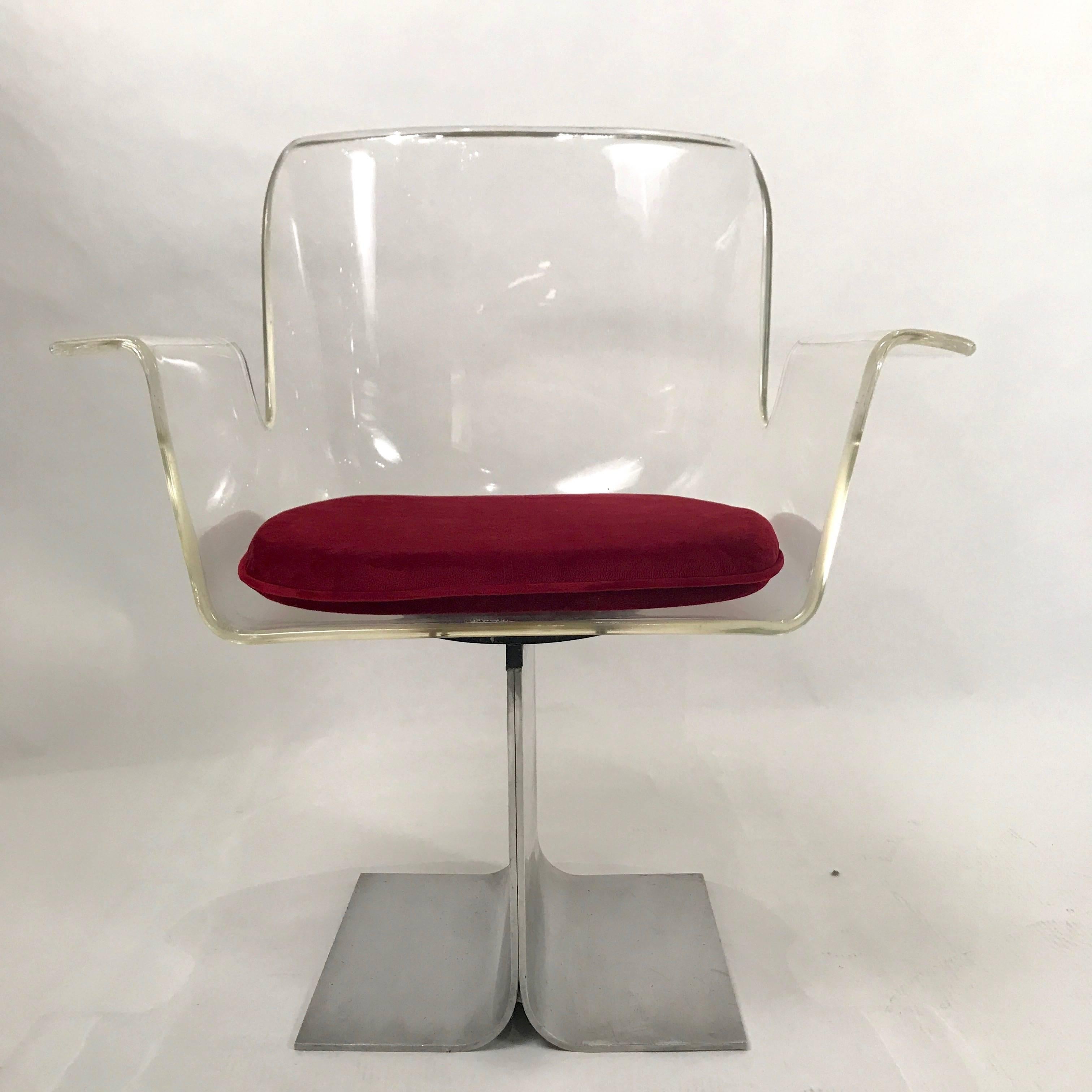 Pair of 171 dining or conference chairs designed by l.M. Rosen for The Pace Collection Inc. These chairs are in great condition. Lucite body with heavy aluminum base. Memory swivel chair - quite comfortable. These chairs make a statement!