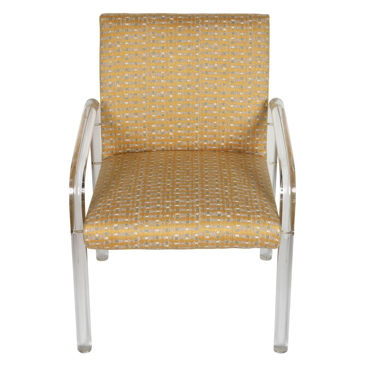 A vintage pair of Leon Frost for Pace Collection lucite arm chairs, newly upholstered in an ochre ground and french blue and white geometric patterned fabric. The transparent lucite frames create a sleek, modern silhouette that contrasts beautifully