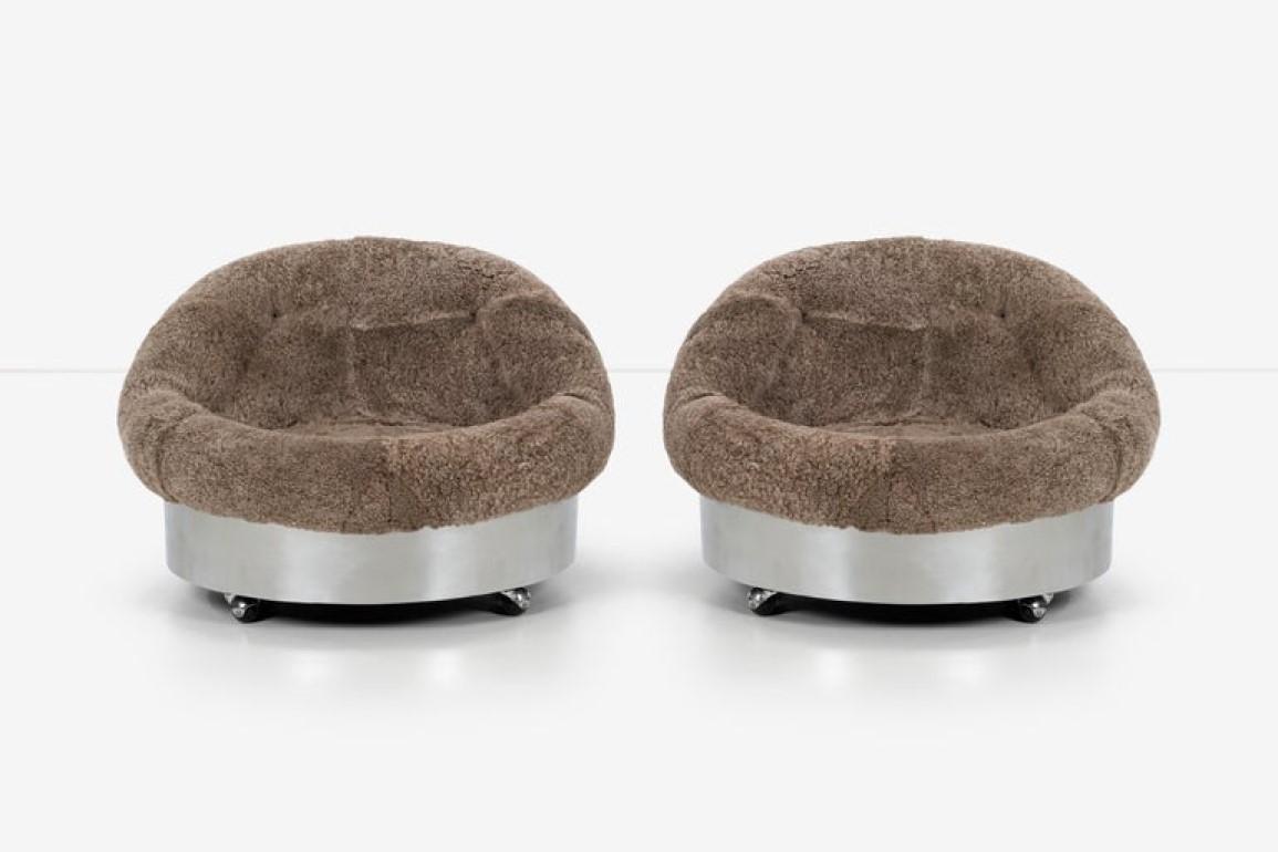 Pair of pace styled lounge chairs with lamb’s wool tubs and leather tufted buttons.
Stainless steel metal on wheels, reupholstered in faux lamb’s wool by Great Plains.