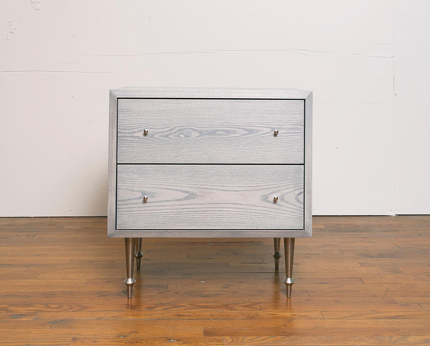 Solid ash with nickel plated legs and drawer pulls.
Greywashed finish.
Dimensions: 25” W x 16” D x 26