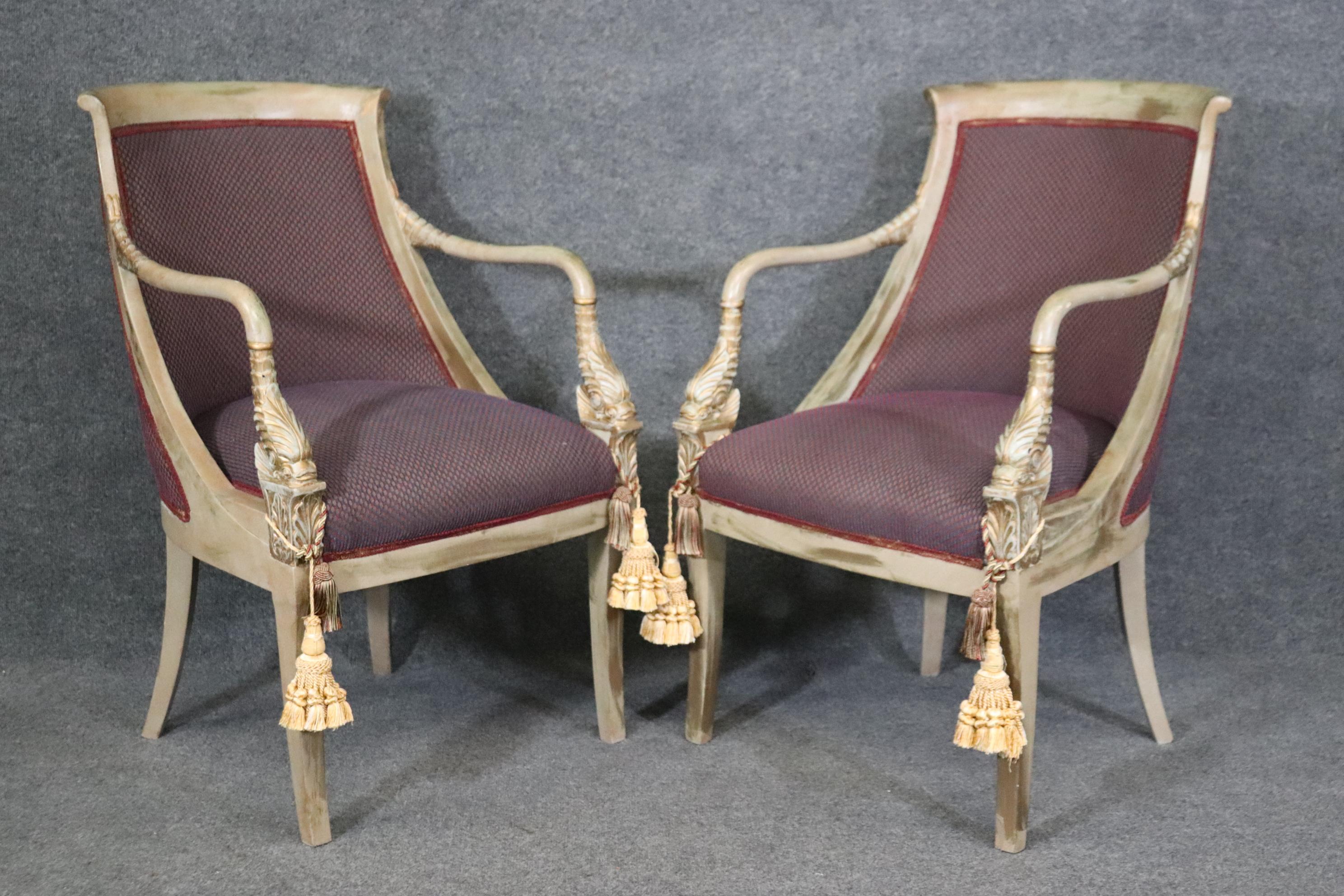 These are a fun and classic pair of chairs. The chairs are done in Regency or neoclassical style and feature stylized 