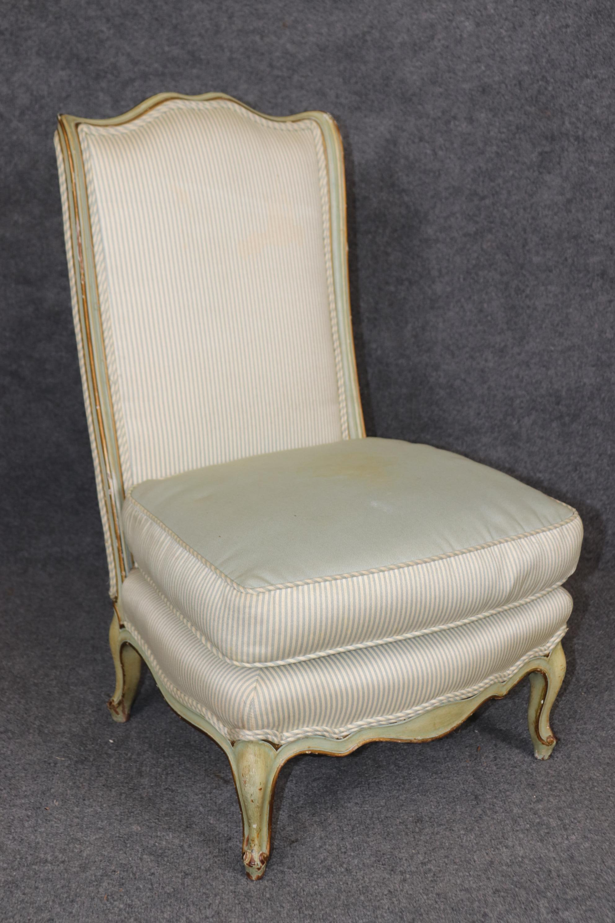 This is a rare pair of boudoir or slipper chairs. The chairs are in their original robins egg blue-green finish and has signs of age and distressing and the upholstery is entirely original with stains and signs of age and use. Measures 33 tall x 20