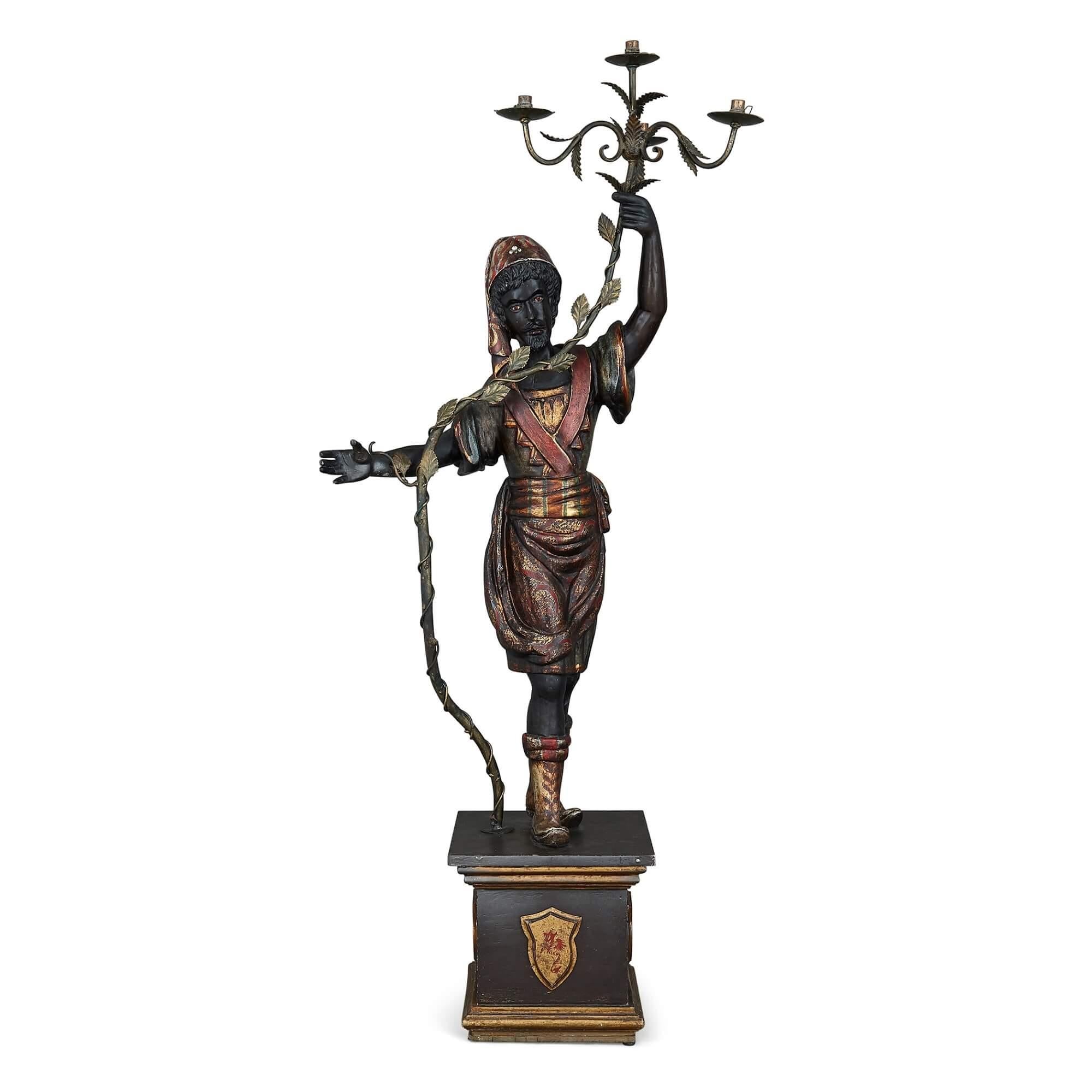 Italian Pair of Painted and Ebonised Wood Floor-Standing Figurative Candelabra For Sale