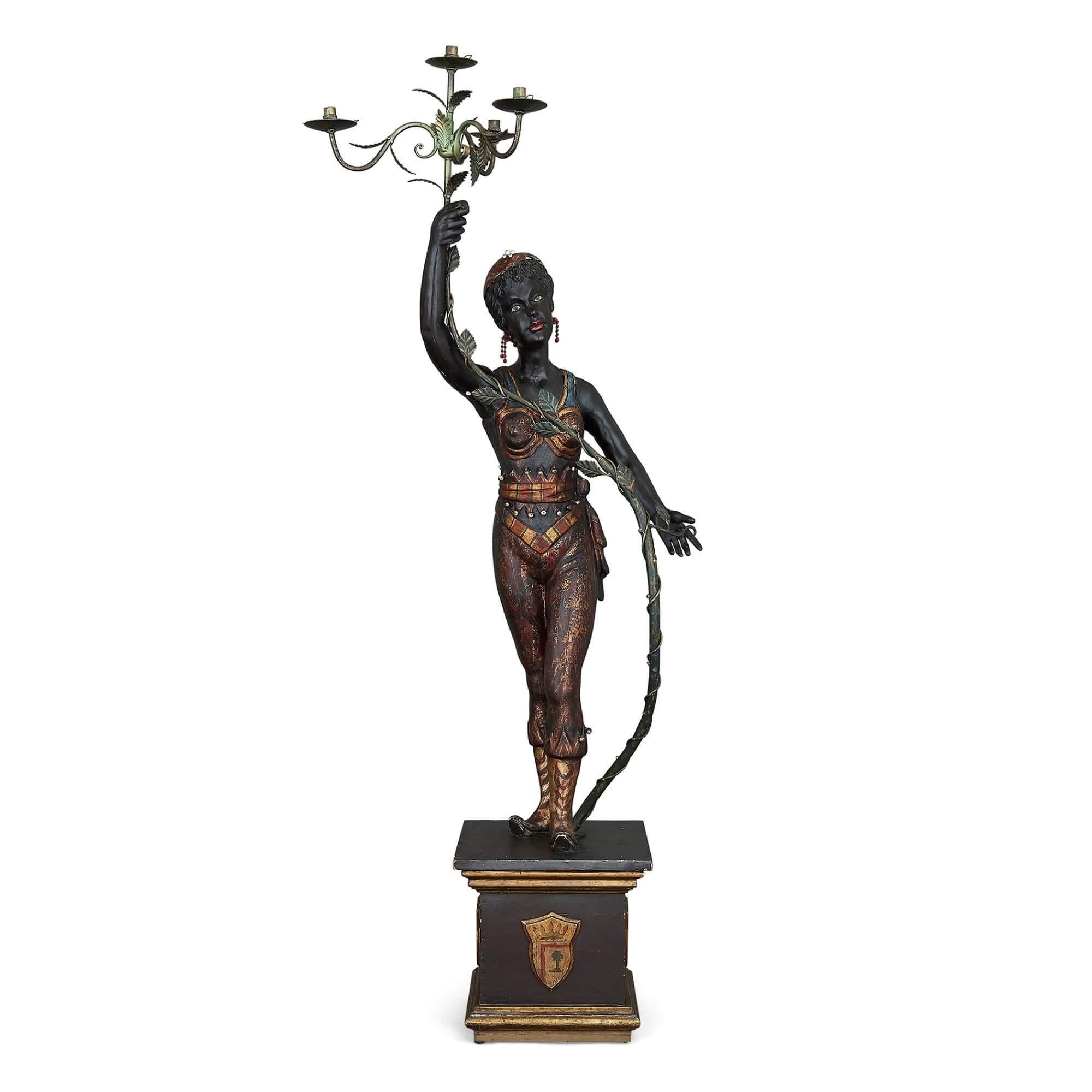 Ebonized Pair of Painted and Ebonised Wood Floor-Standing Figurative Candelabra For Sale