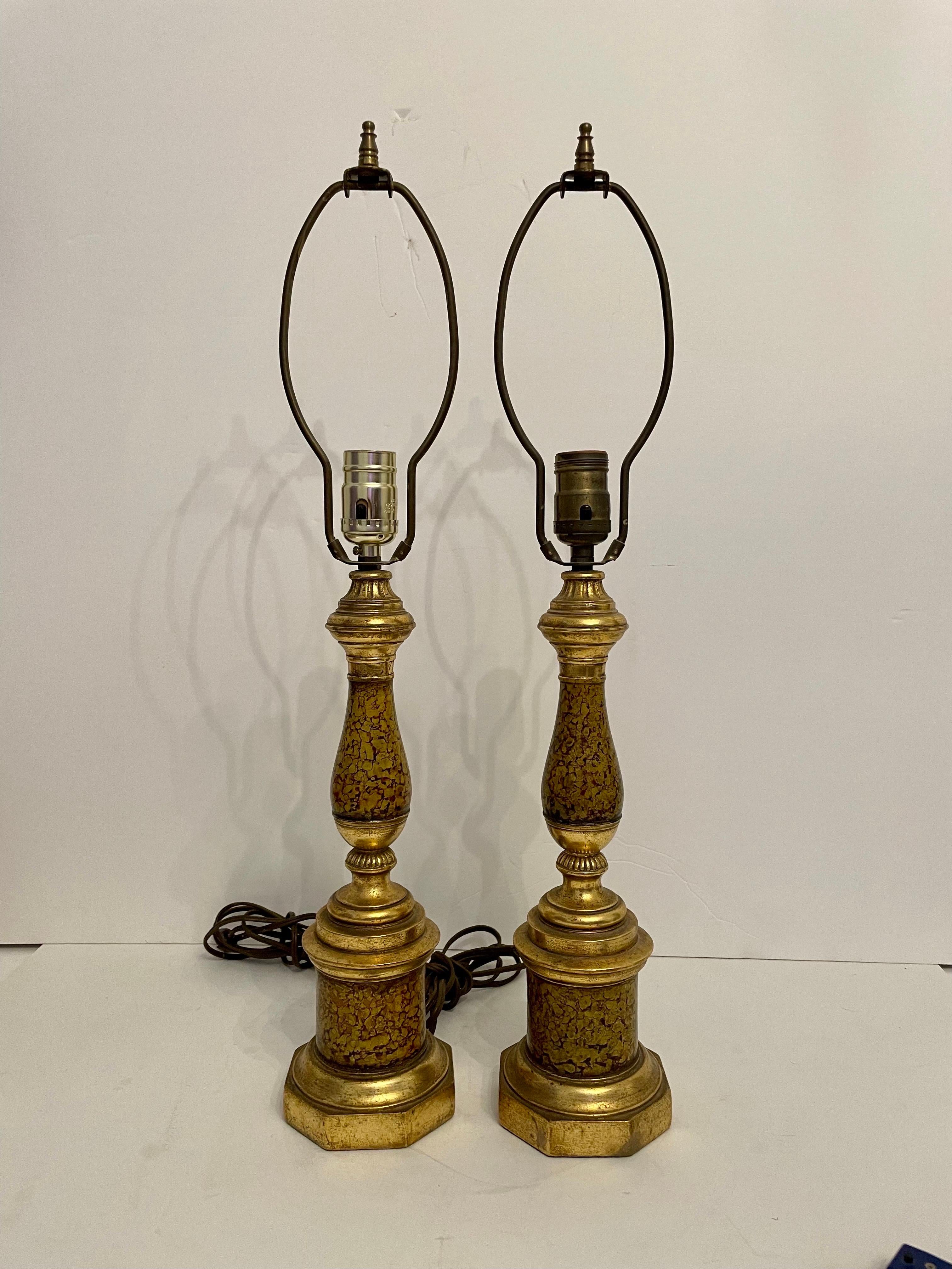 Pair Of Painted and Gilt Borghese Table Lamps. In original untouched condition with original gilt stripe shades included. Borghese sticker on bottoms. Very good quality. 24