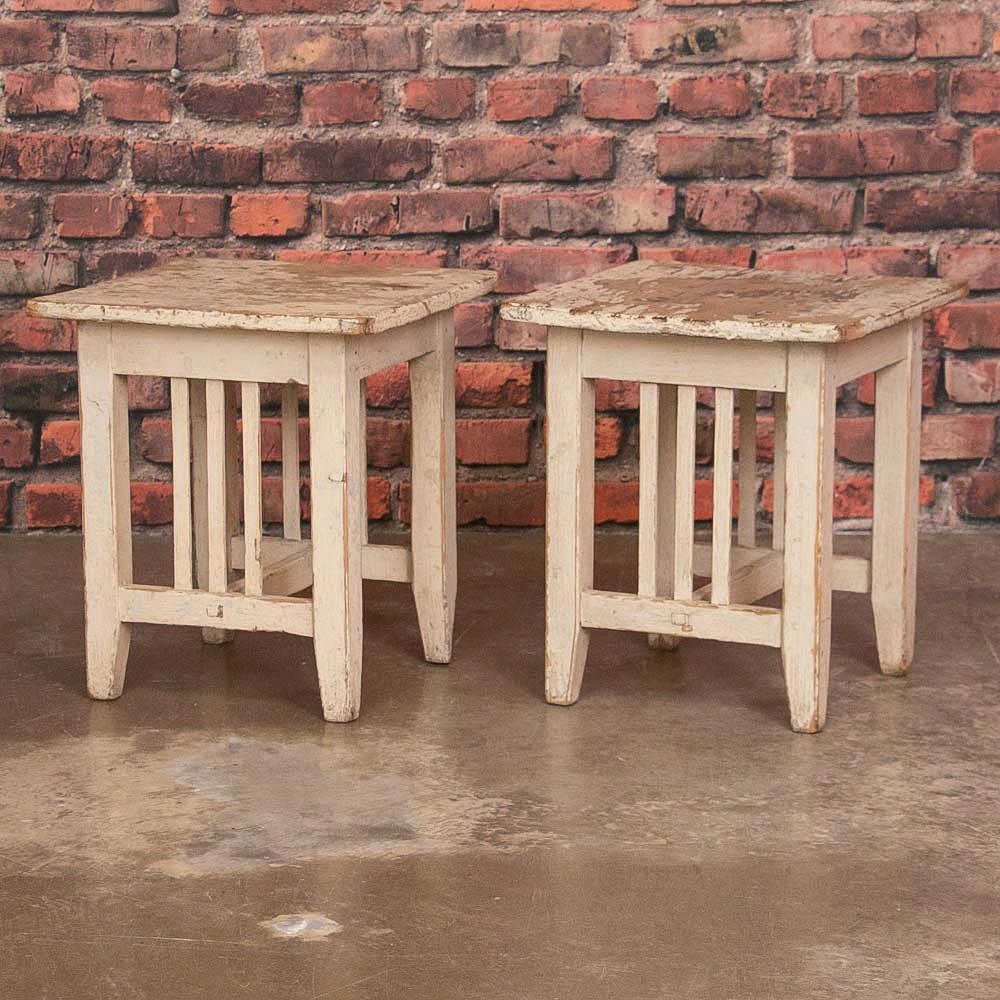 Fun and funky, the naturally distressed off white paint with a light blue undercoat gives this pair of stools a 