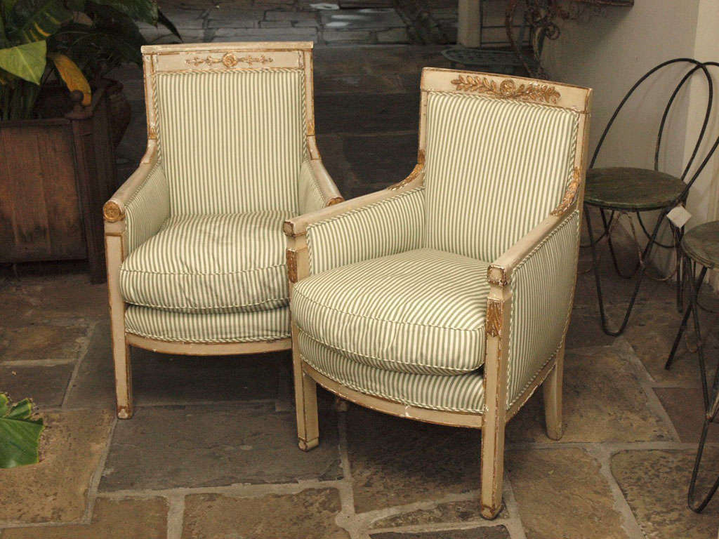Painted with gilt accents. Splendid as a pair, note that the carvings do not match. Sizes are nearly identical, varying less than an inch in H, W, and D.