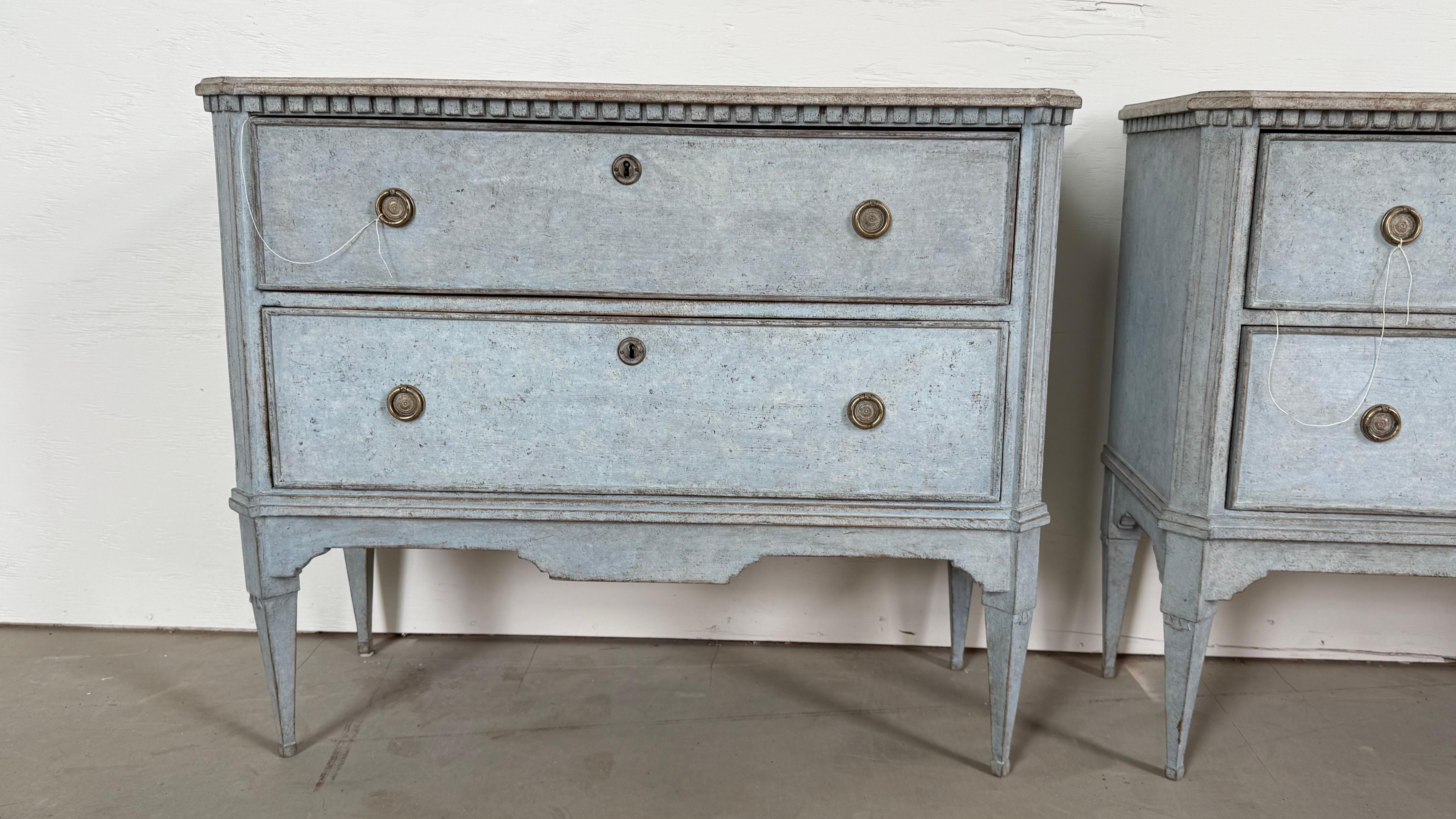 Bring timeless Scandinavian charm into your home with this exquisite pair of 19th-century Swedish chest of drawers. Painted in a soft, serene blue with a contrasting whitish-grey top, these chests blend rustic elegance with classic sophistication.
