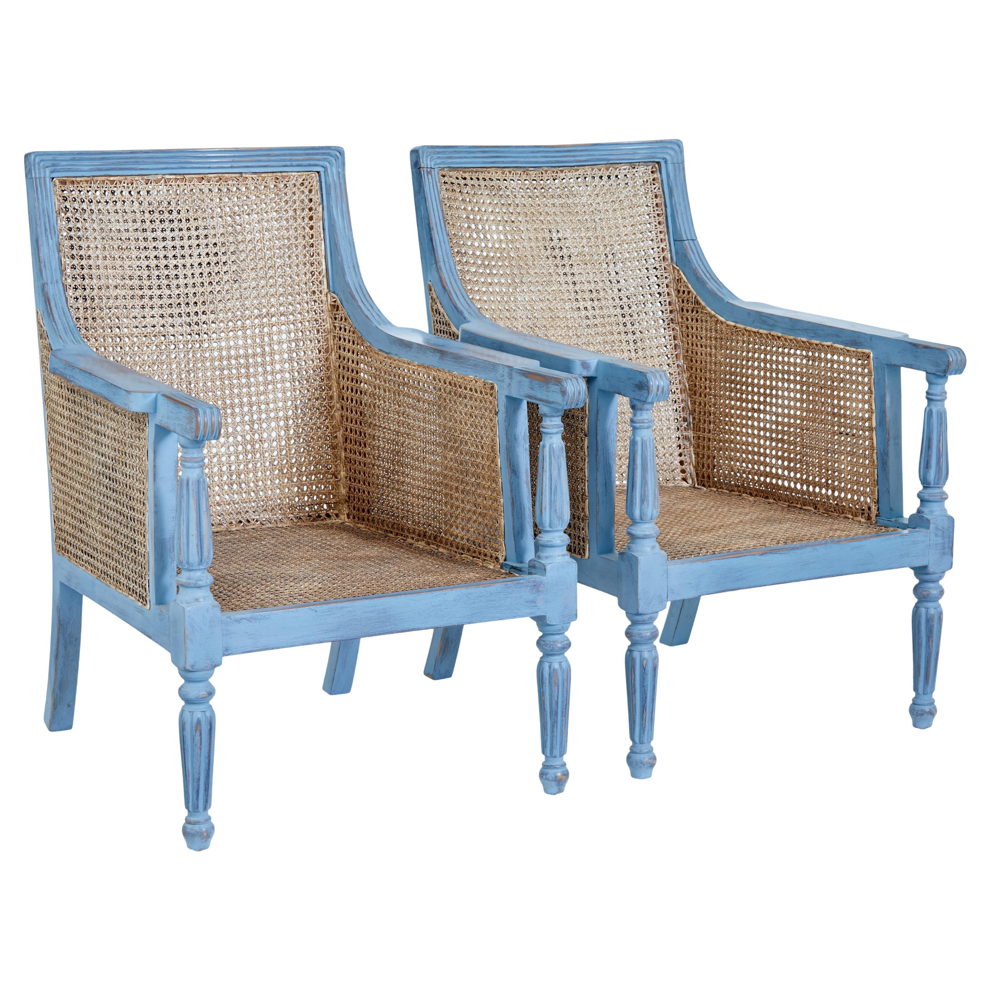 Pair of painted cane work bergere armchairs