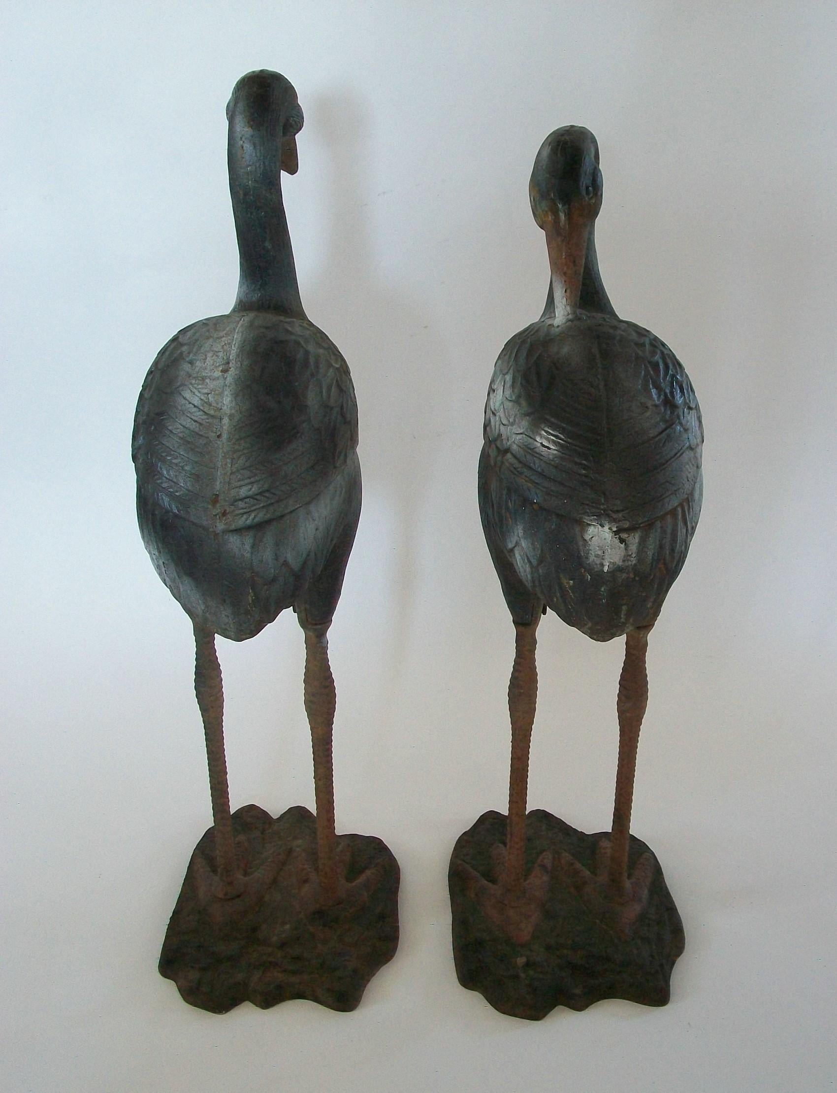 French Pair of Painted Cast Iron Heron Garden Sculptures - France - circa 1930s For Sale