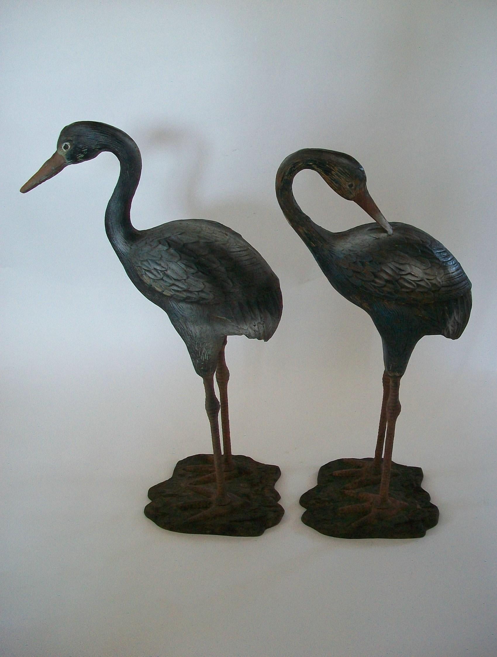 Hand-Crafted Pair of Painted Cast Iron Heron Garden Sculptures - France - circa 1930s For Sale