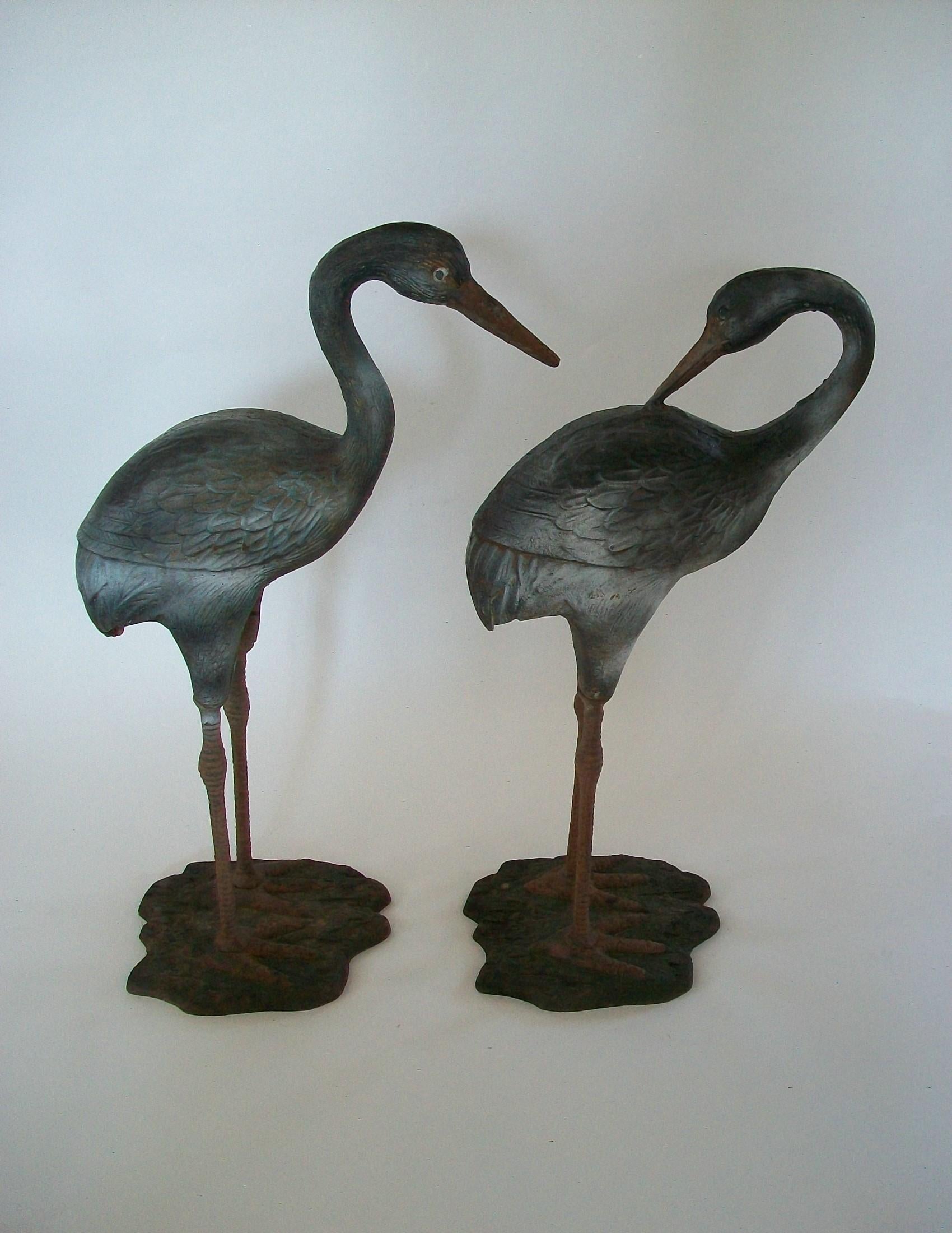 Pair of Painted Cast Iron Heron Garden Sculptures - France - circa 1930s In Good Condition For Sale In Chatham, ON