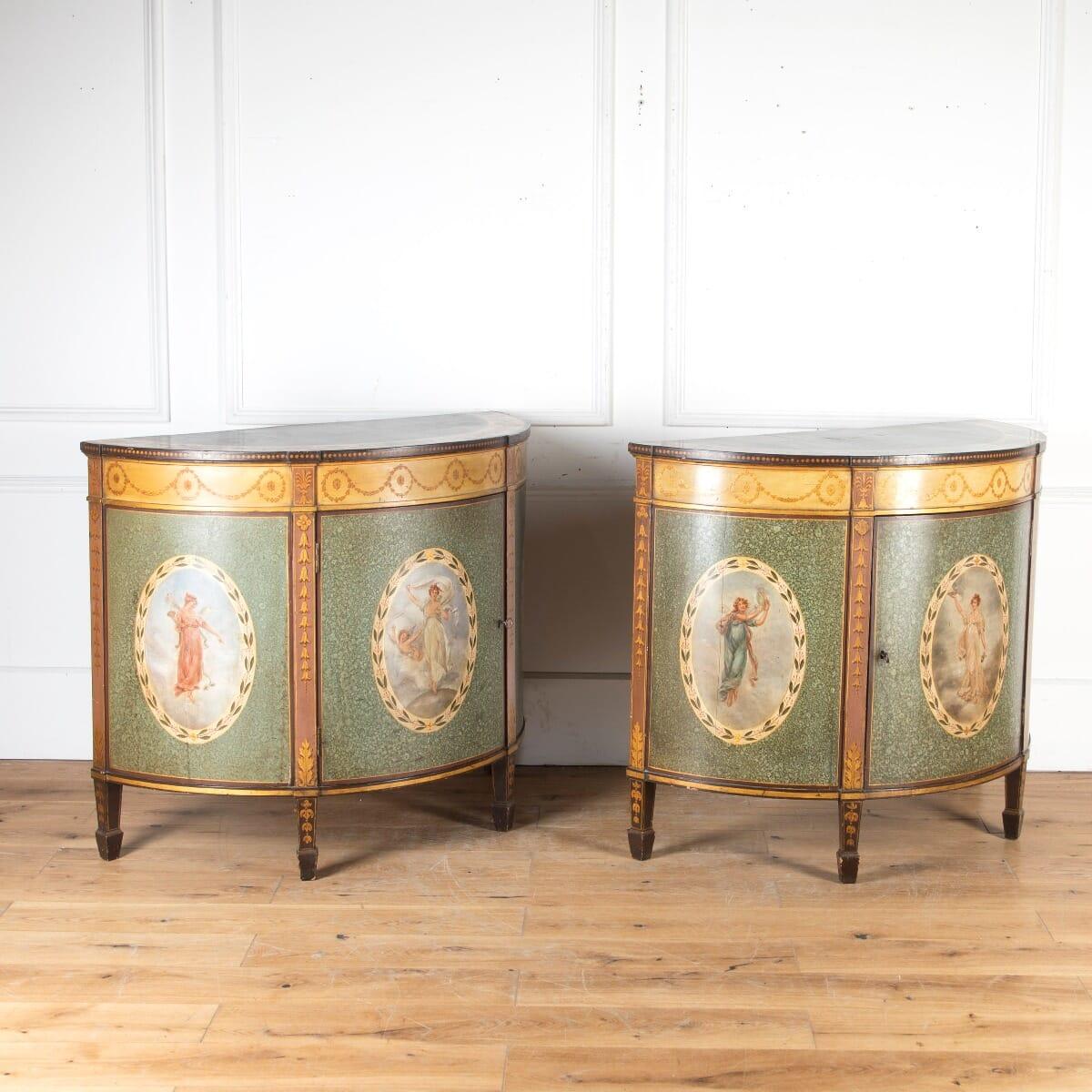 Exceptional pair of 19th century superior quality demilune side cabinets. This beautiful pair are firmly attributed to Wright & Mansfield of Bond Street, London.

The tops feature simulated inlaid fanned quadrants to the centre and wide borders of