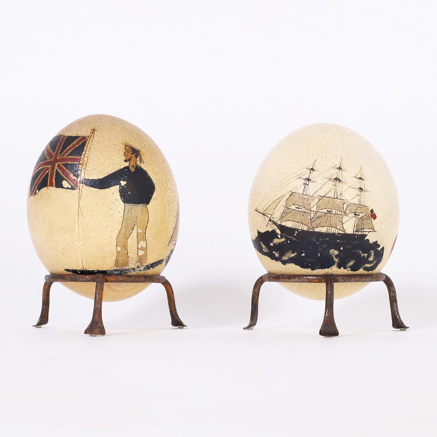 Rare and historically significant English pair of ostrich eggs etched and paint decorated with patriotic emblems commemorating the the 1st Boer war. Priced Individually.
 