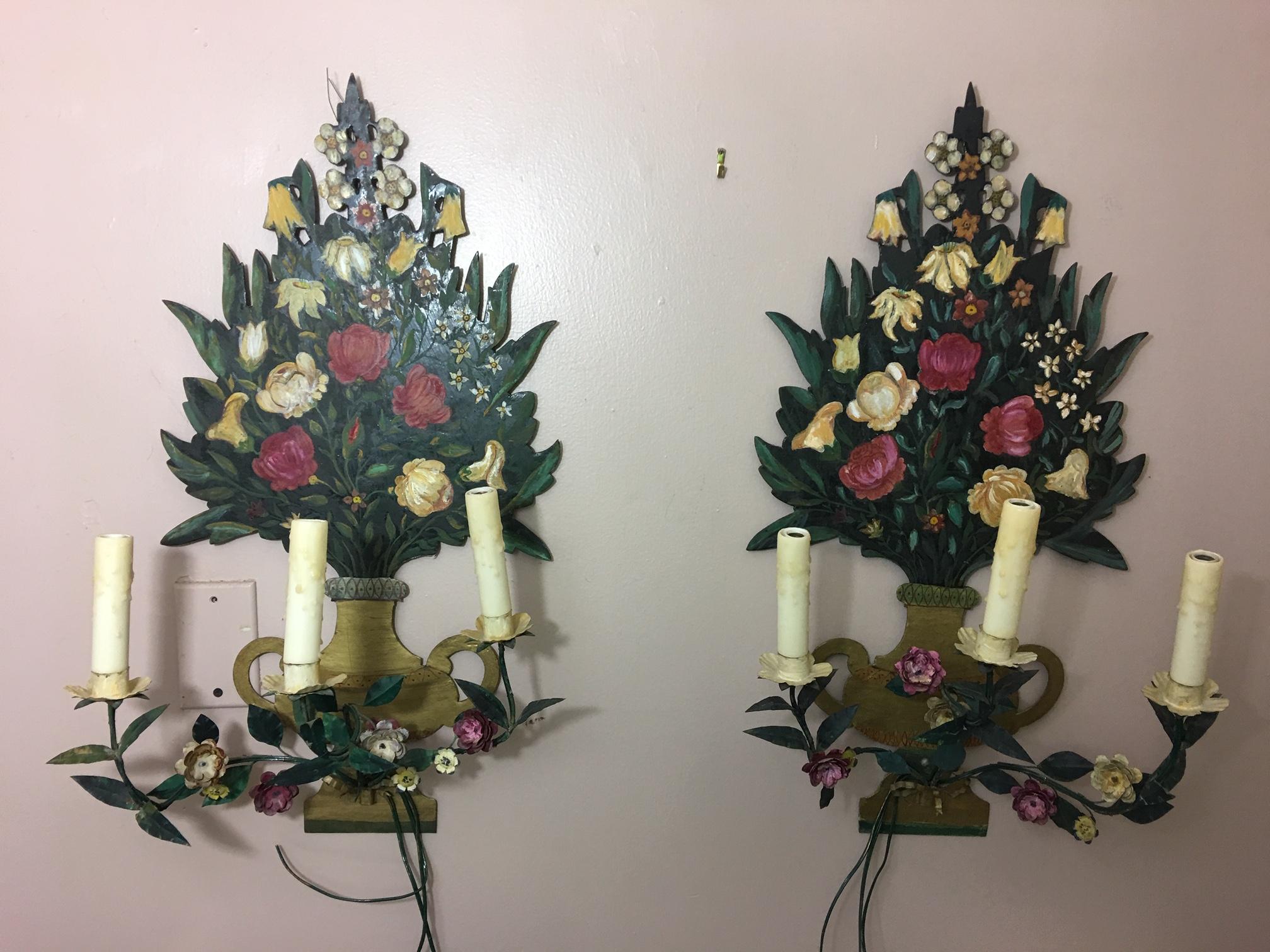 Pair of painted flower back three-light wall sconces, mid-20th century.