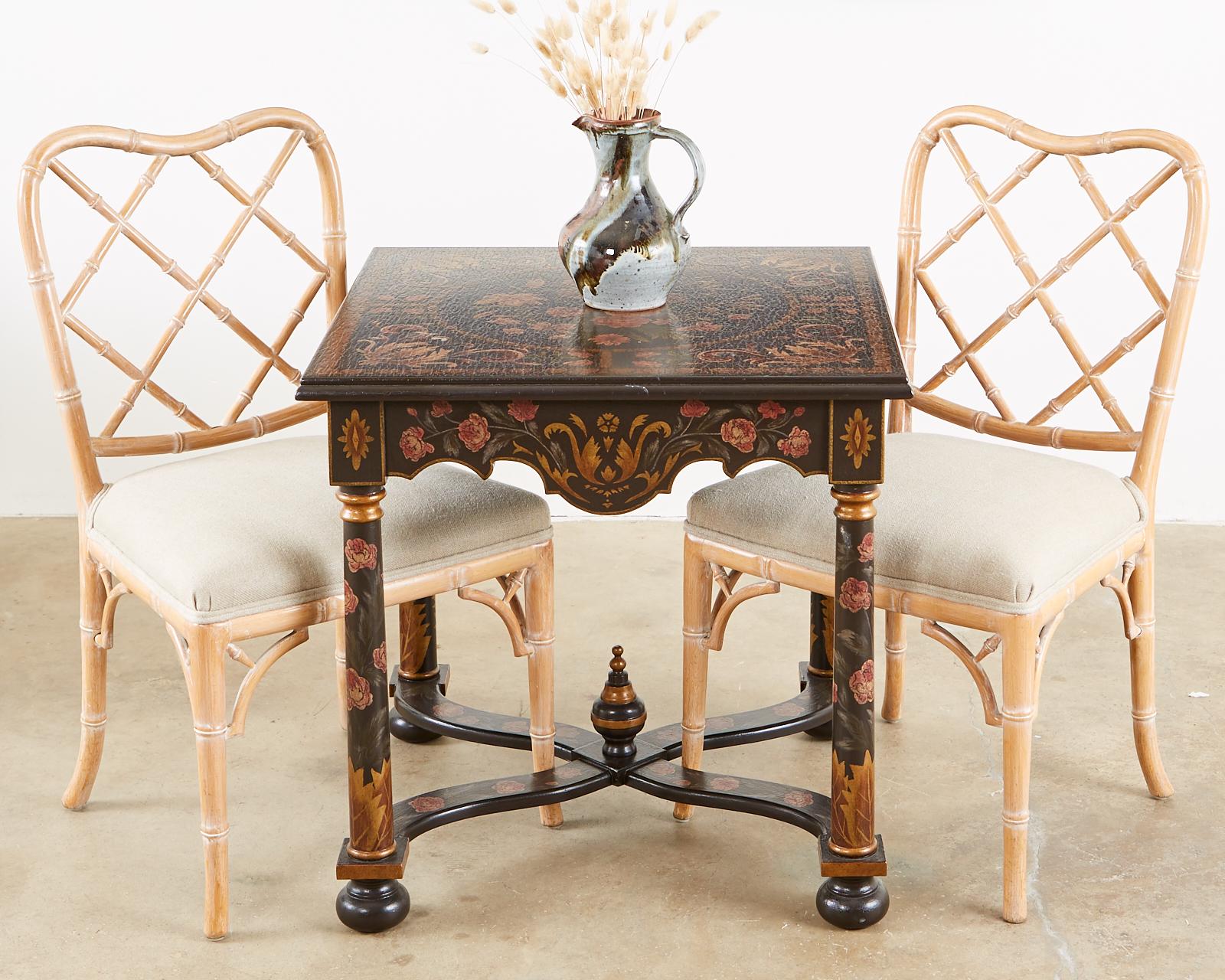 Extraordinary pair of lacquer painted lamp tables or end tables made in the French Louis XIII taste. Decorated with colorful floral motifs and faux aged craquelure lacquer finish. Supported by column style legs conjoined with curved x form