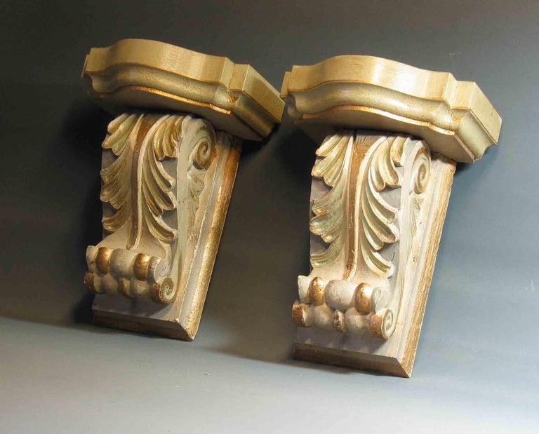 Pair of Painted and Gilt Carved Wood Wall Brackets in the Style of