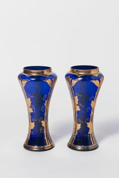 Pair of painted gold and glass vases. France, Early 20th Century.