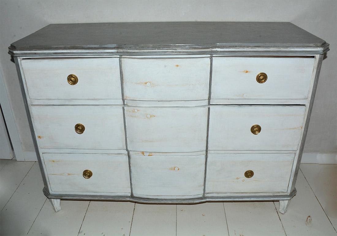 Custom made Swedish Rococo style chest of drawers with wonderfully curvaceous serpentine drawers and fluted sides painted a bluish grey. 