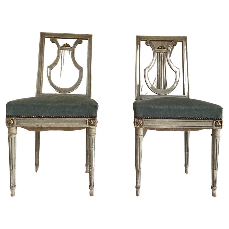Pair of painted Louis XVI style chairs with blue velvet seat For Sale at 1stDibs