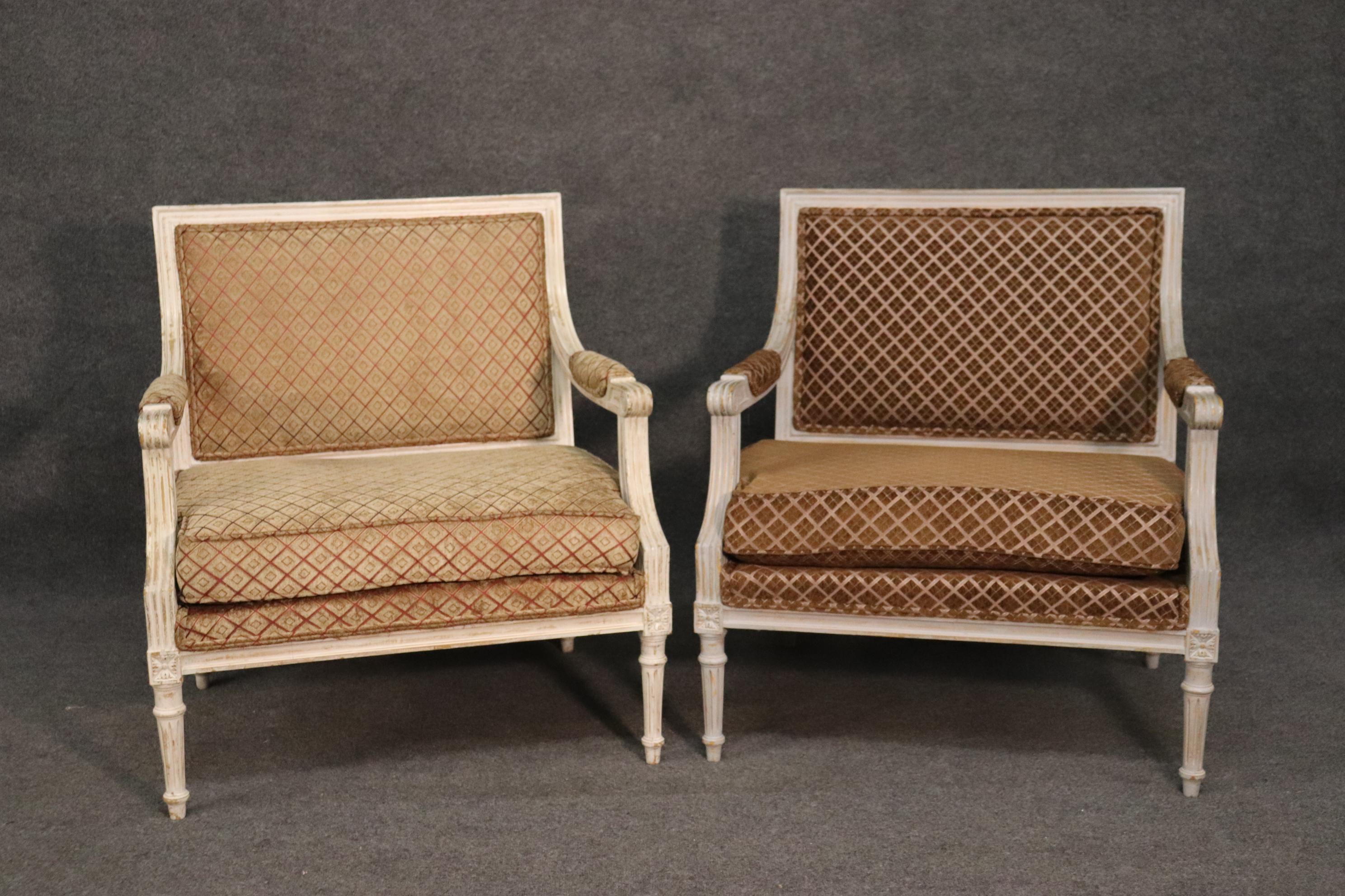 These beautiful distressed finish settee-like chairs are in very good condition and have beautiful upholstery.  One chair has a slightly different upholstery than the other and slightly lighter color frame too. The chairs measure 35 inches tall x