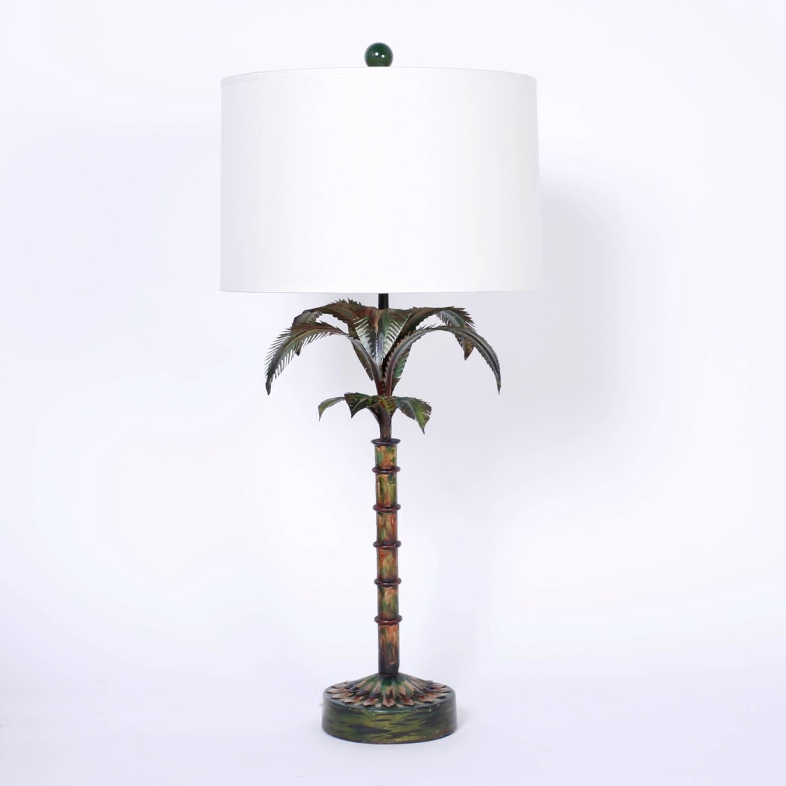 Stand out pair of painted metal or tole palm tree table lamps with a stylized form and a modern rustic faux finish. Newly wired.