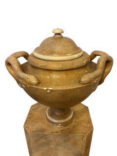 Pair of painted plaster vases with porphyry decoration in the antique style.