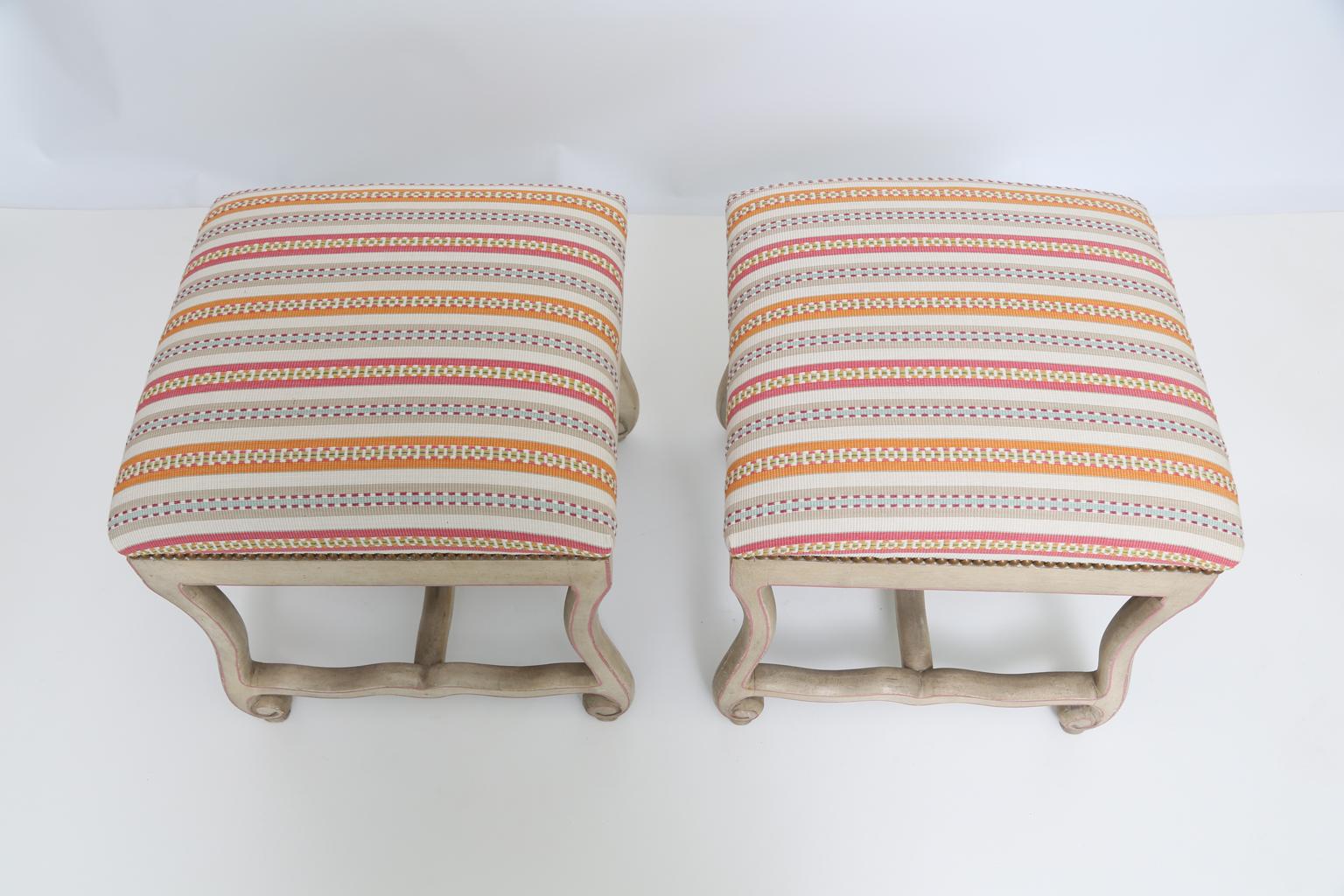 Pair of Os de Mouton stools, in the Provincial taste, having a painted finish showing natural wear, upholstered crown seats with nailheads. 

Stock ID: D2576.