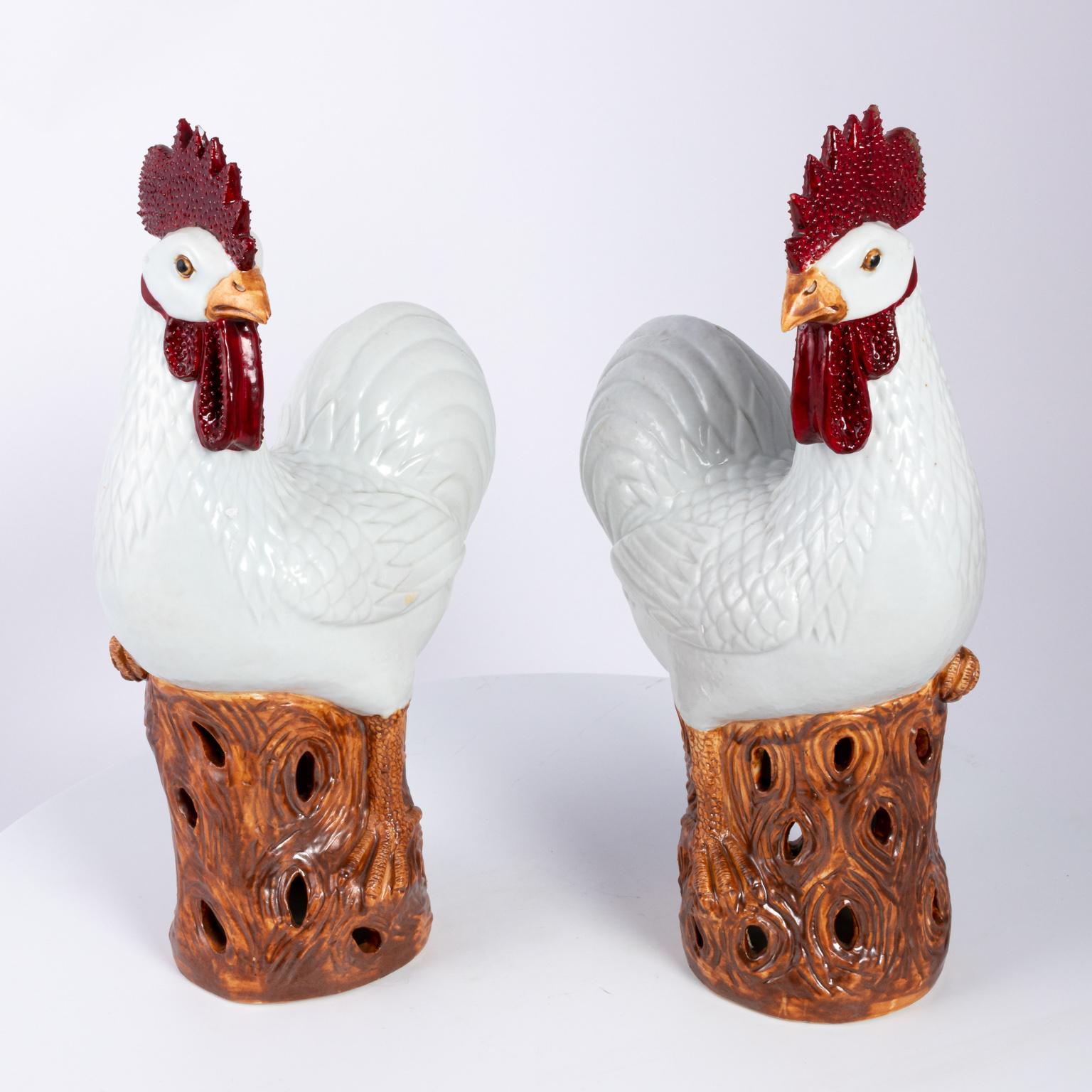Pair of decorative Rooster Statues painted with beautiful colors and lines in the style of Chinese Qing Dynasty, circa 2000. Please note of wear consistent with age.