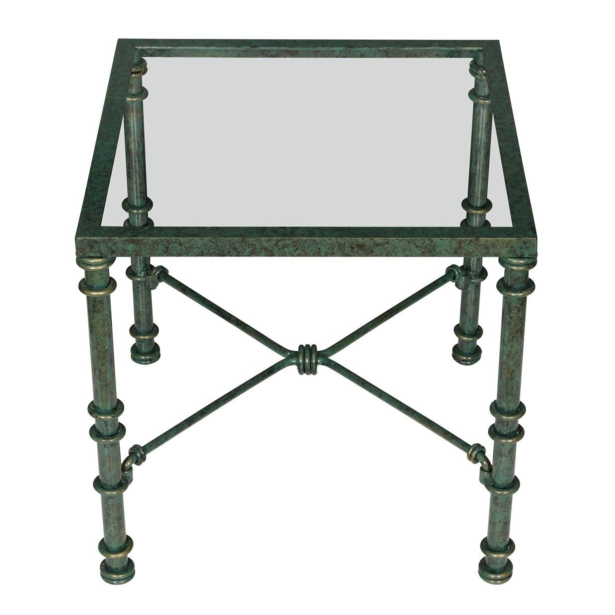 A pair of painted metal verdigris glass top square side tables with X shaped bottoms.