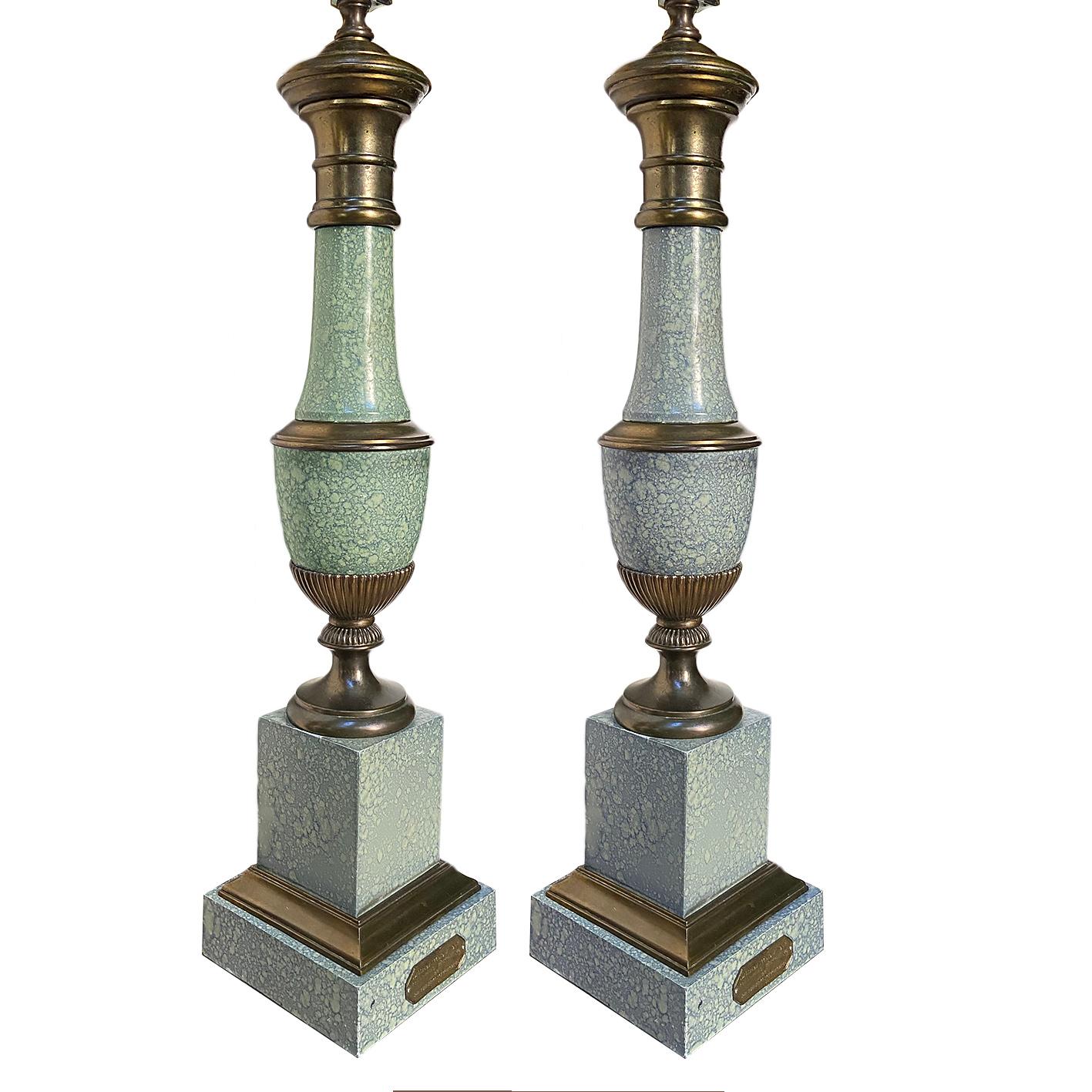 Pair of circa 1930's French painted tole lamps with brass details.

Measurements. 
Height of body: 23
