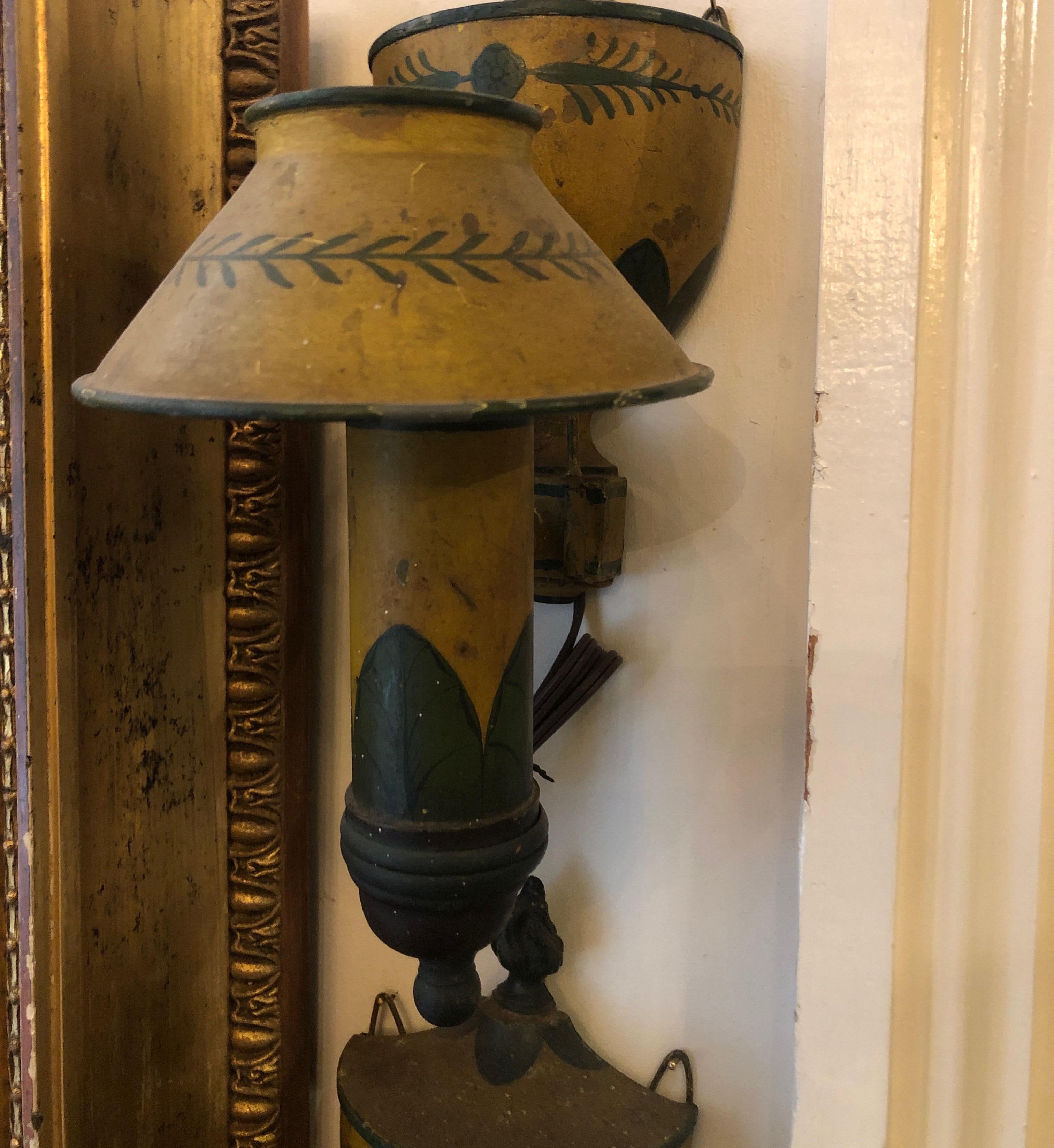 Pair of late 19th-early 20th century wall sconces wired for electricity. Shades removable. The paint appears original and has darkened with age.