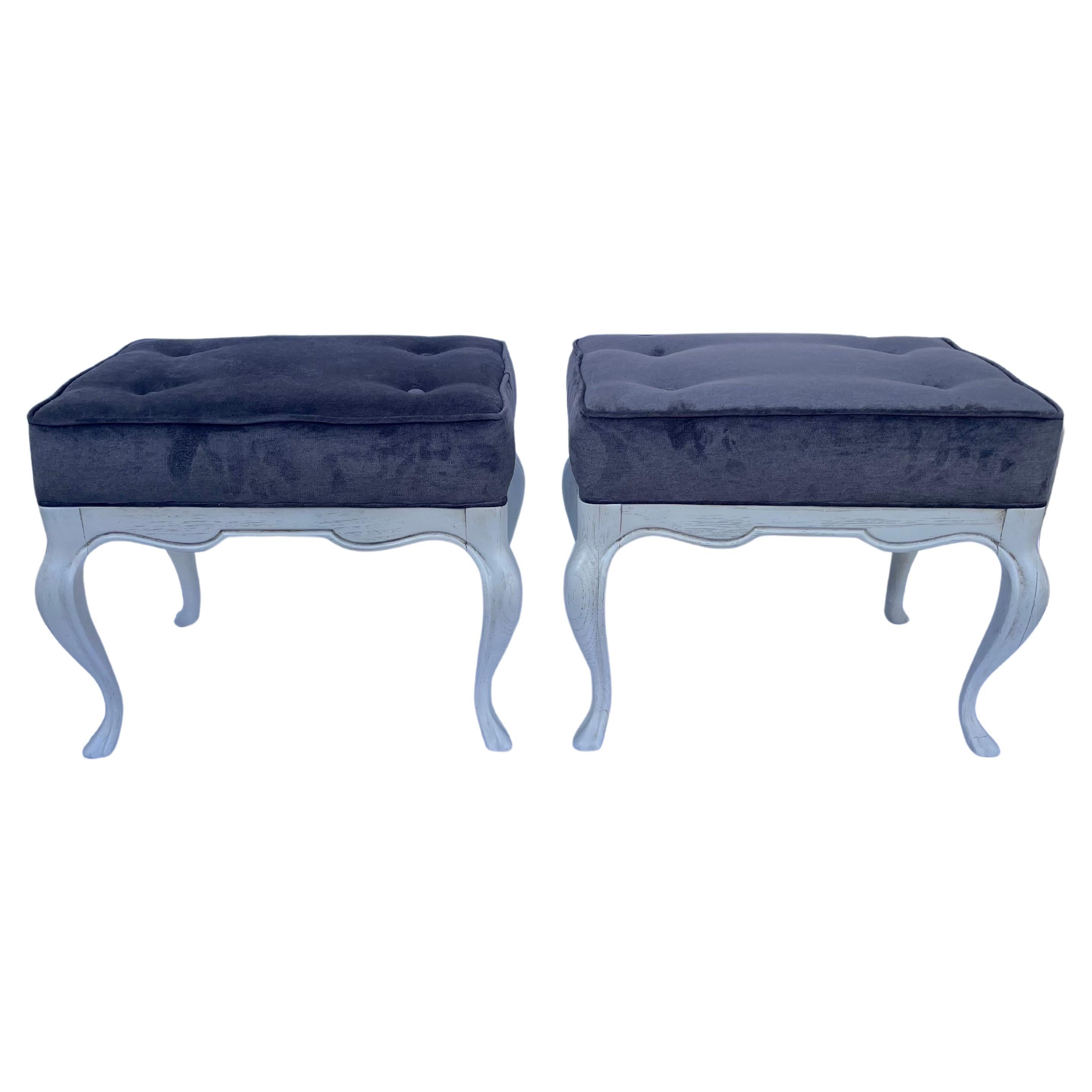 Pair Of Painted Benches. Newly upholstered in charcoal velvet with four buttons and welting. Each measures 21” wide x 15” deep x 17” tall. Benches were repainted at some point. These can be professionally packed and shipped, price depends on
