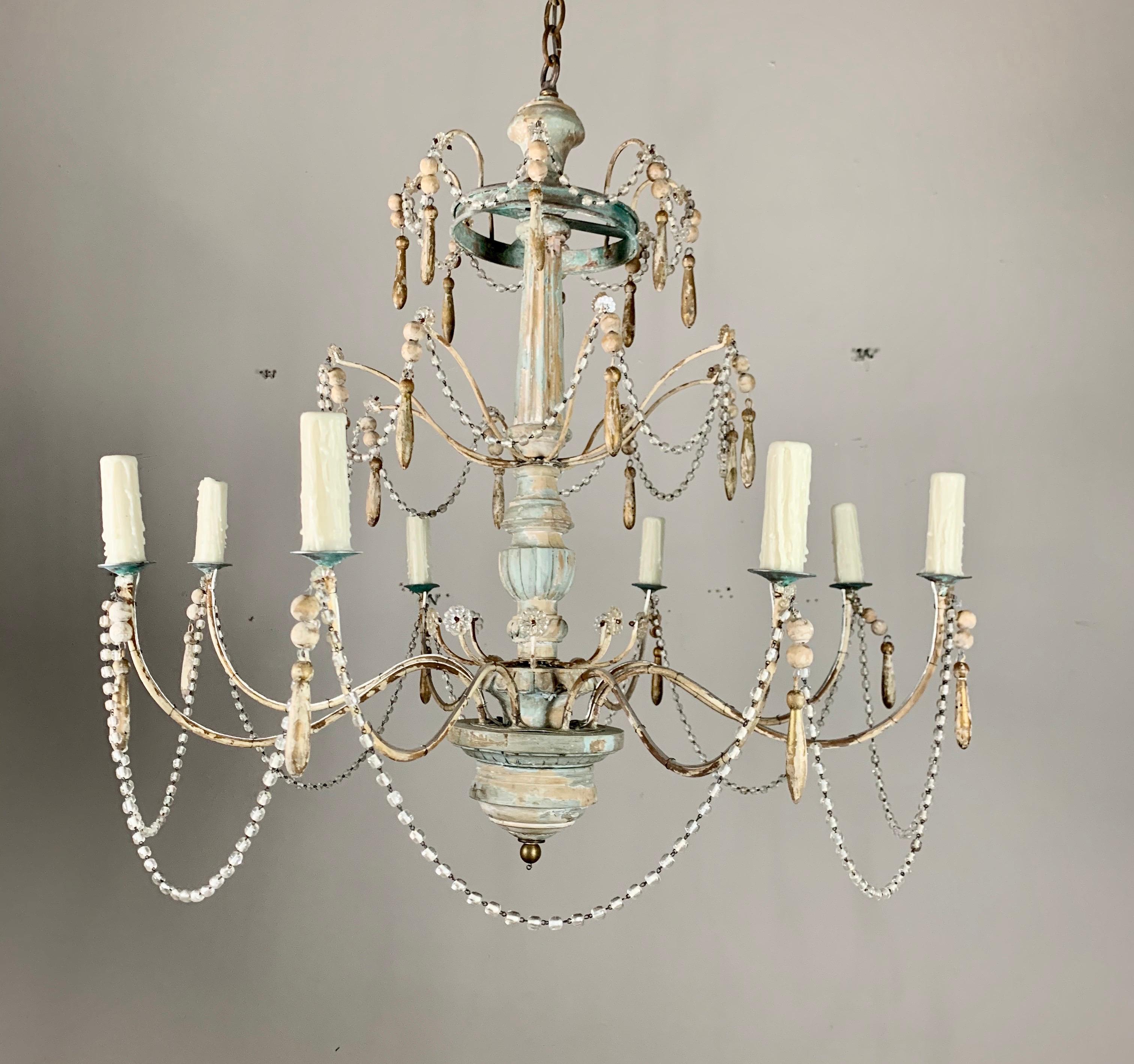 Pair of 8-light painted wood and metal chandeliers by Melissa Levinson Antiques. We can make these in any painted or gilt wood finish. We also sell them as a single or a pair. Wired with drip wax candle covers and includes chain and canopies.