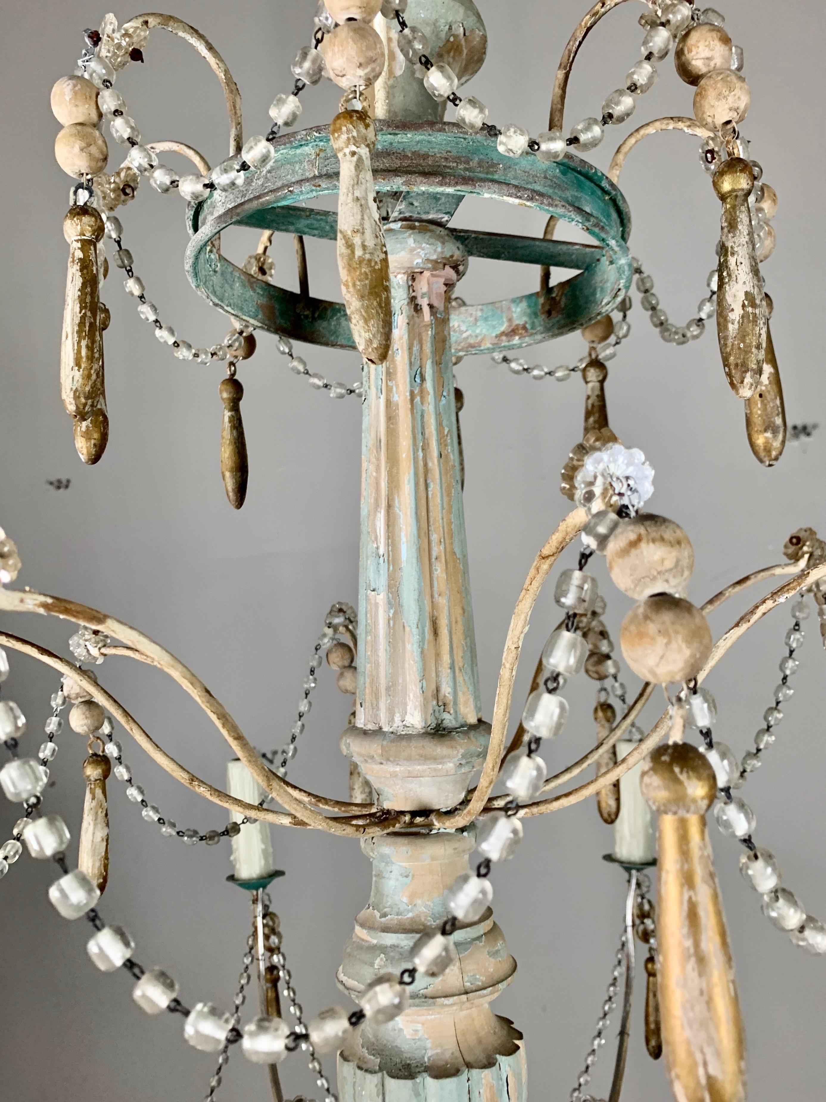 Pair of Painted Wood Beaded Chandeliers by MLA In Distressed Condition For Sale In Los Angeles, CA