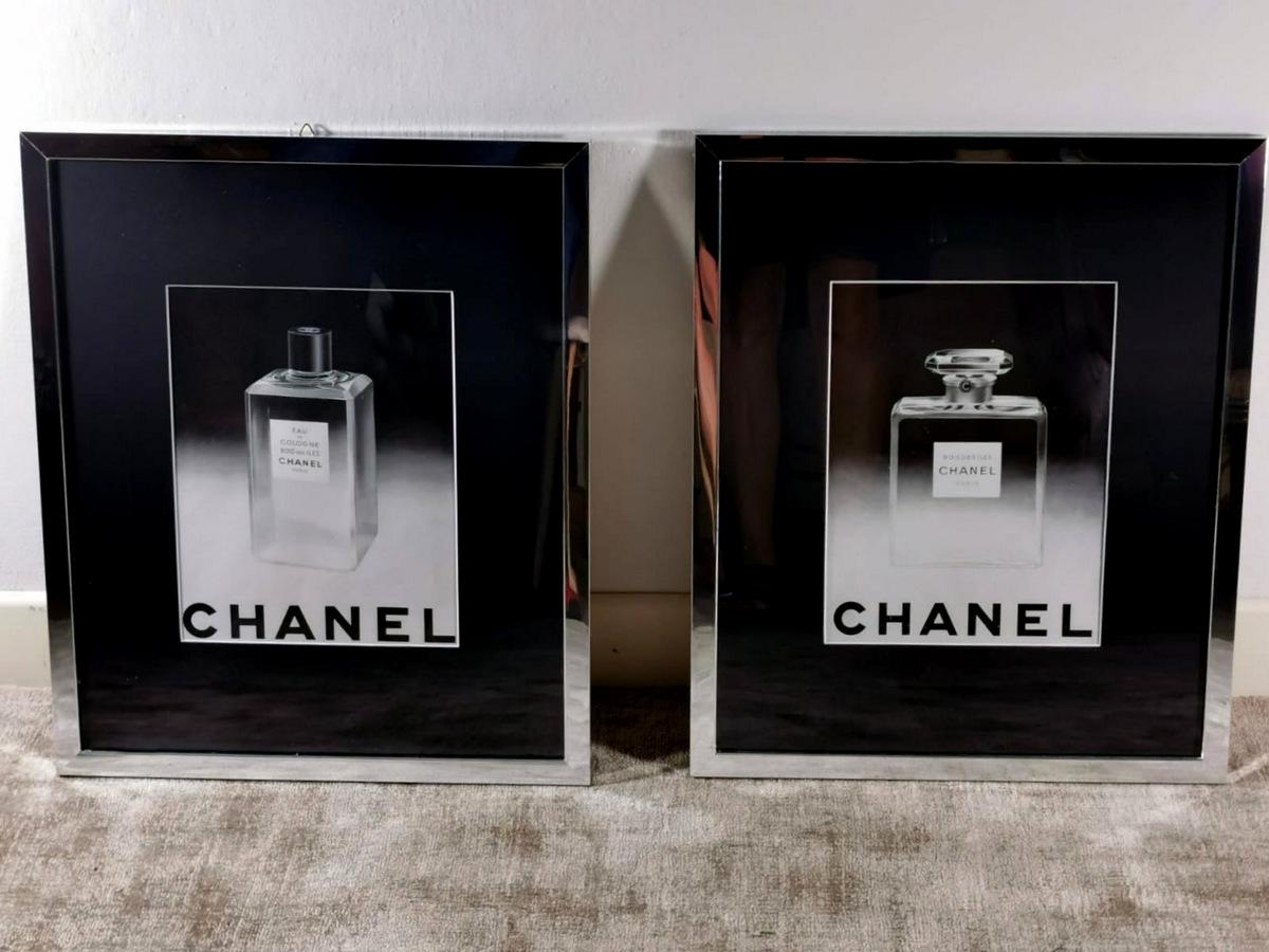 Pair of paintings which are framed original advertisements for the Chanel perfume 