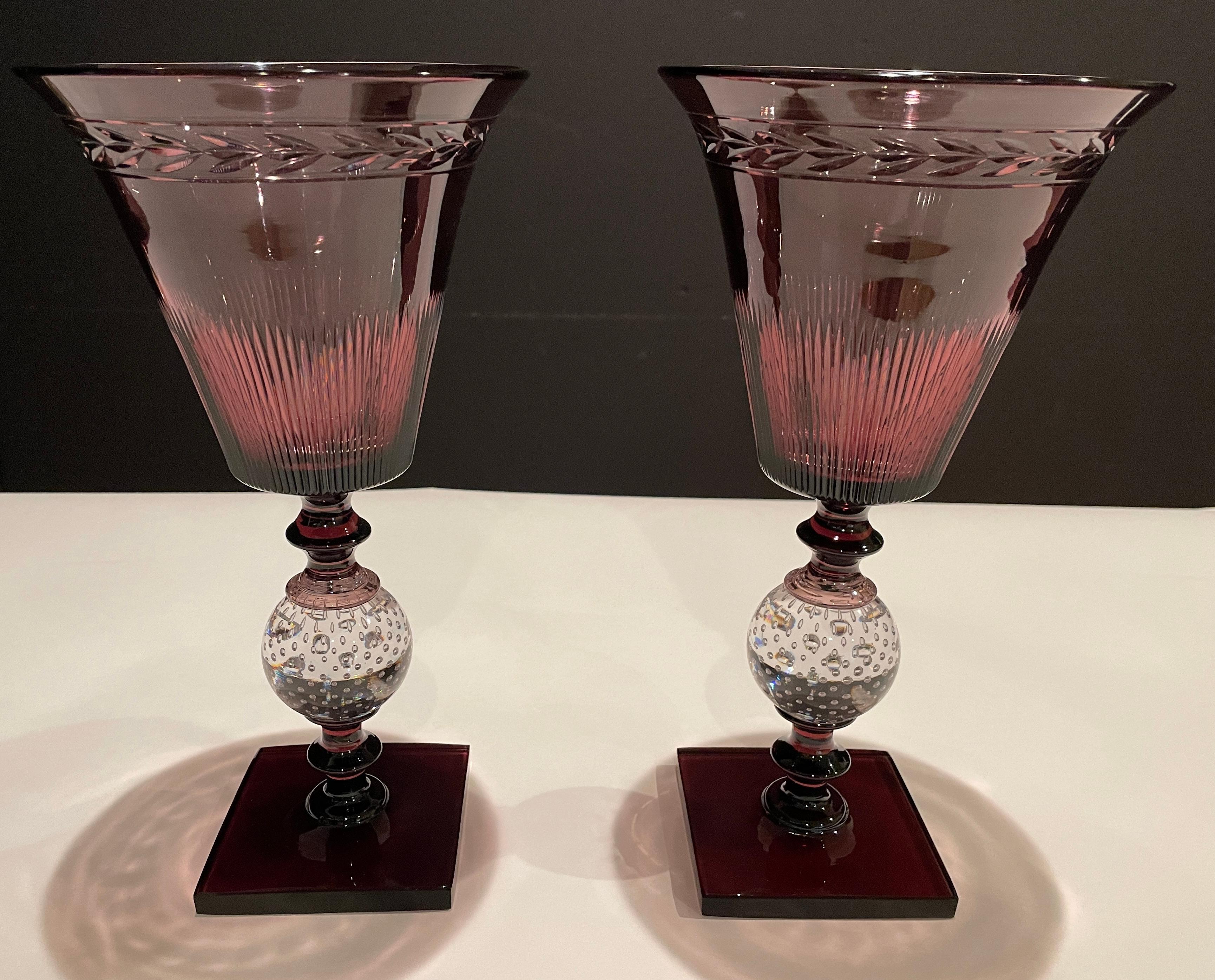 Pair of Pairpoint amethyst glass controlled bubble vases. The flared trumpet form top with copper wheel cut design above a clear controlled bubble ball and an amethyst square base. Elegant and modern lines.