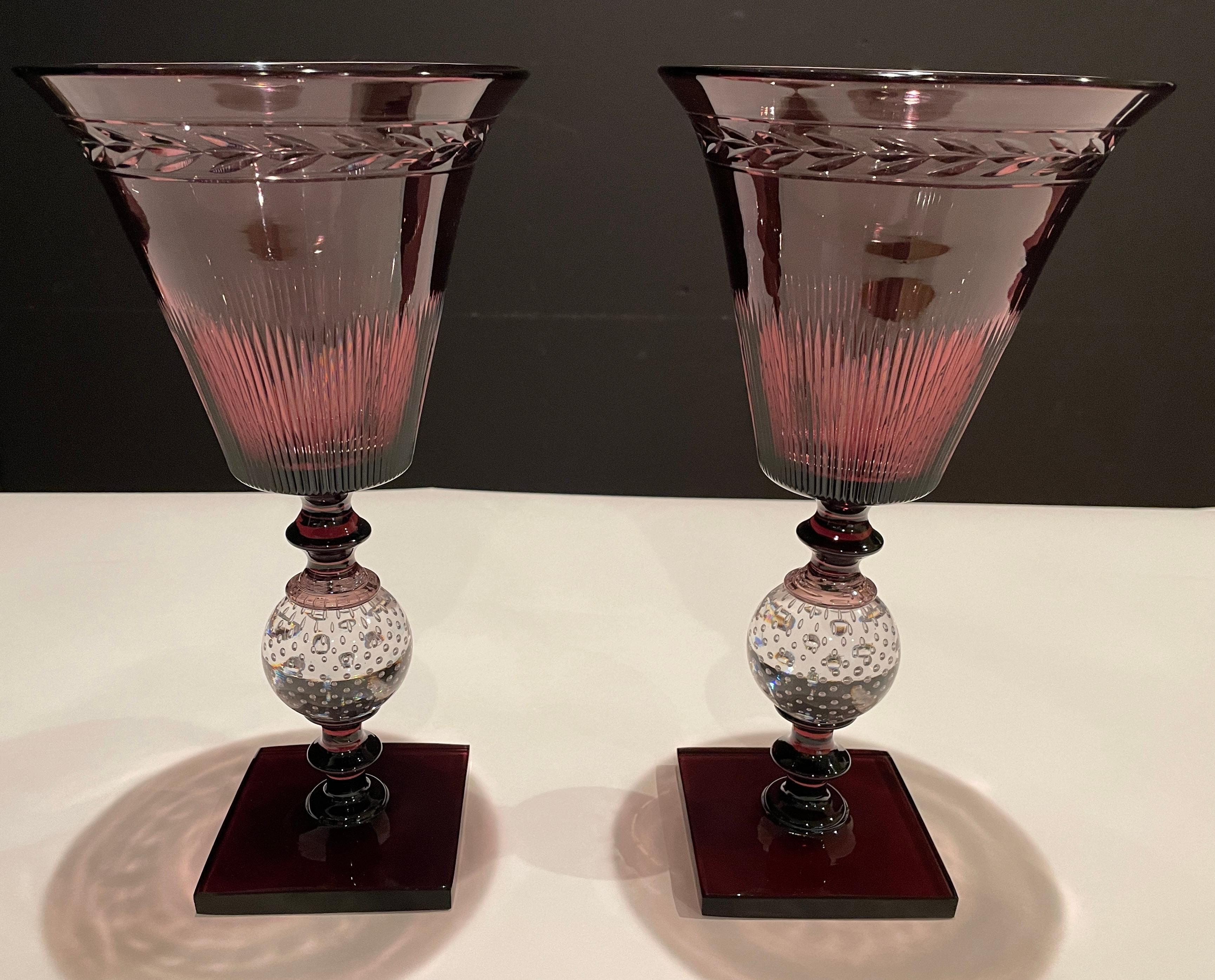 Pair of Pairpoint amethyst glass controlled bubble vases. The flared trumpet form top with copper wheel cut design above a clear controlled bubble ball and an amethyst square base. Elegant and modern lines.