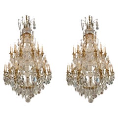 Pair of Palace Size Baccarat Style Gilt Bronze and Crystal 24 Light Chandeliers