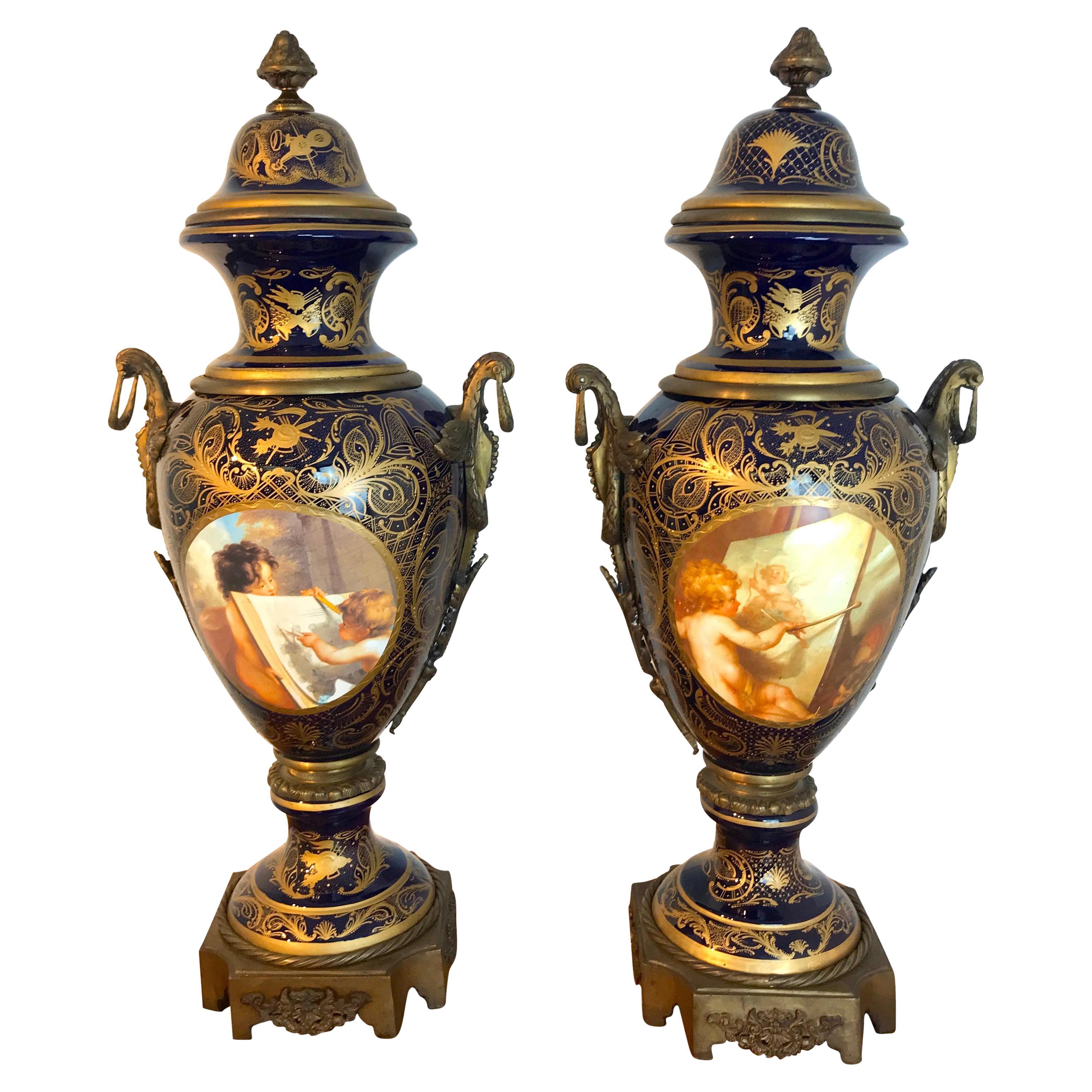 Pair of Palace Size Sevres Style 'Labors of Cupid' Ormolu & Cobalt Urns