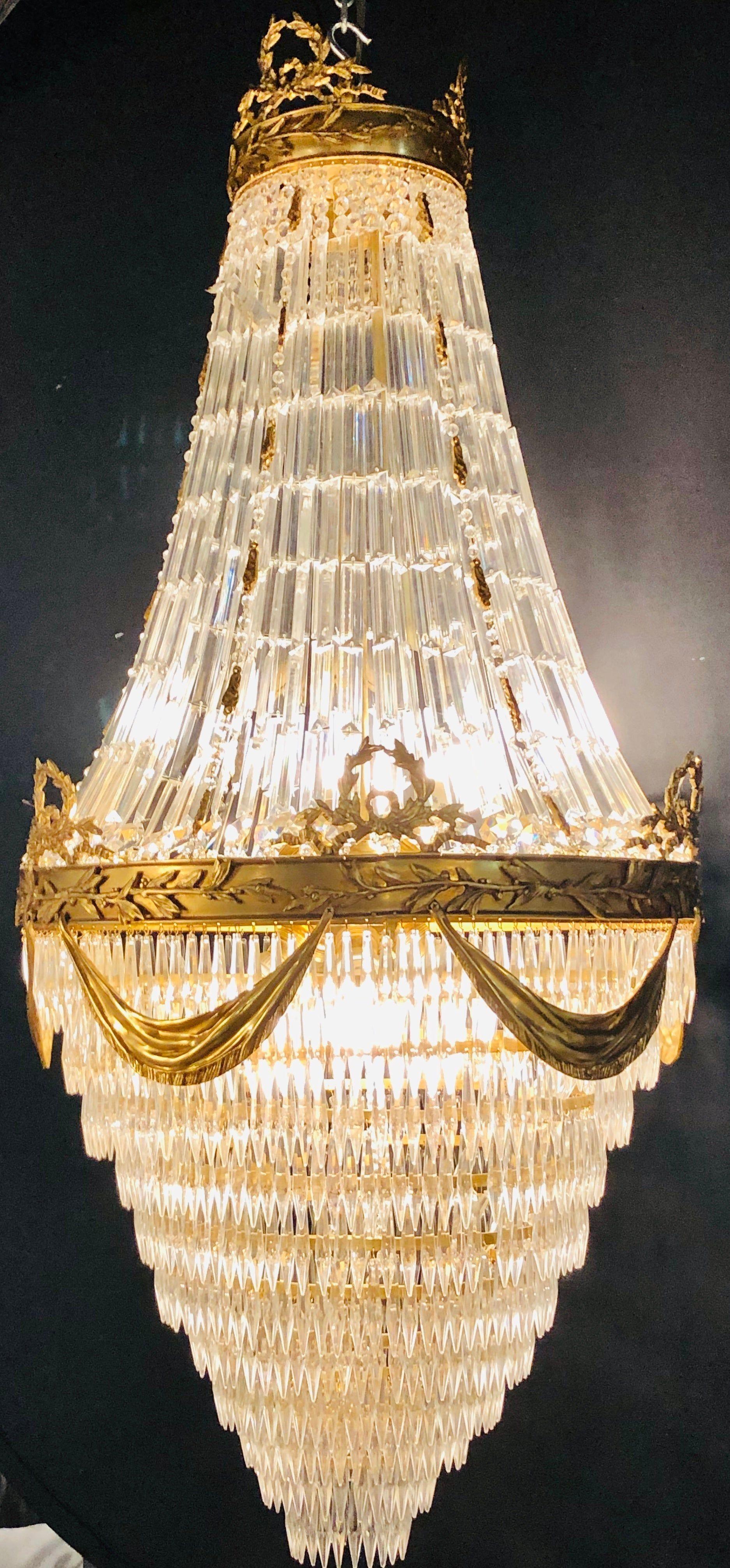 Pair of Palatial Bronze and Crystal Swag Design Louis XVI Style Chandeliers In Good Condition For Sale In Stamford, CT