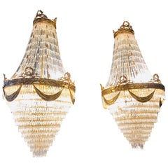 Pair of Palatial Bronze and Crystal Swag Design Louis XVI Style Chandeliers