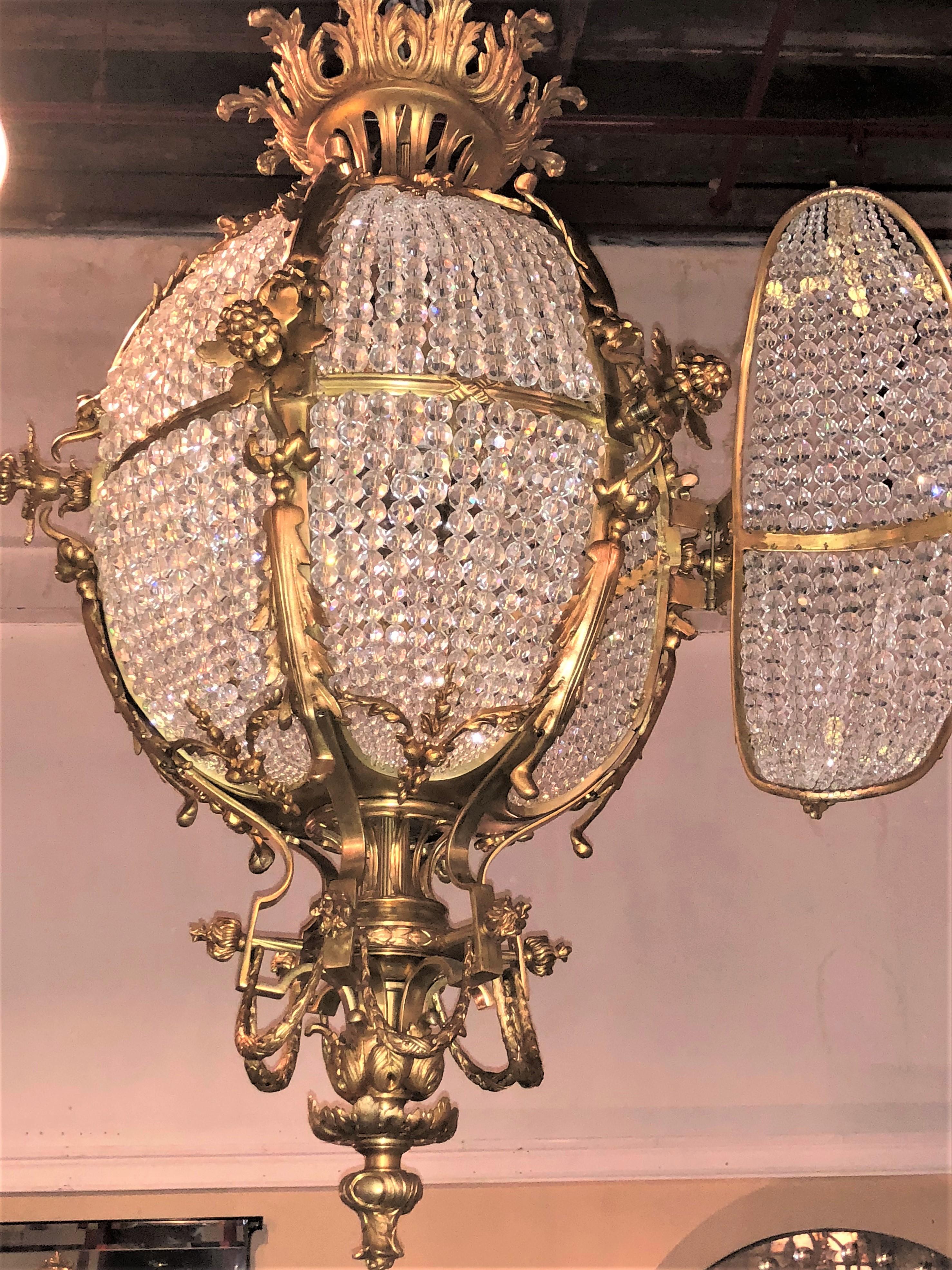 Pair of Palatial Doré Bronze Circular Crystal Beaded Ball Chandeliers In Good Condition In Stamford, CT