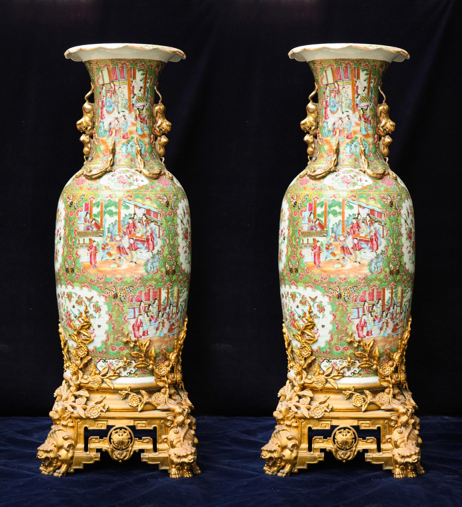 A pair of palatial and highly important chinoiserie style large gilt bronze-mounted Chinese export Famille rose hand-painted polychromed enameled and gilded vases of exquisite craftsmanship embellished on spectacular gilt bronze bases attributed to
