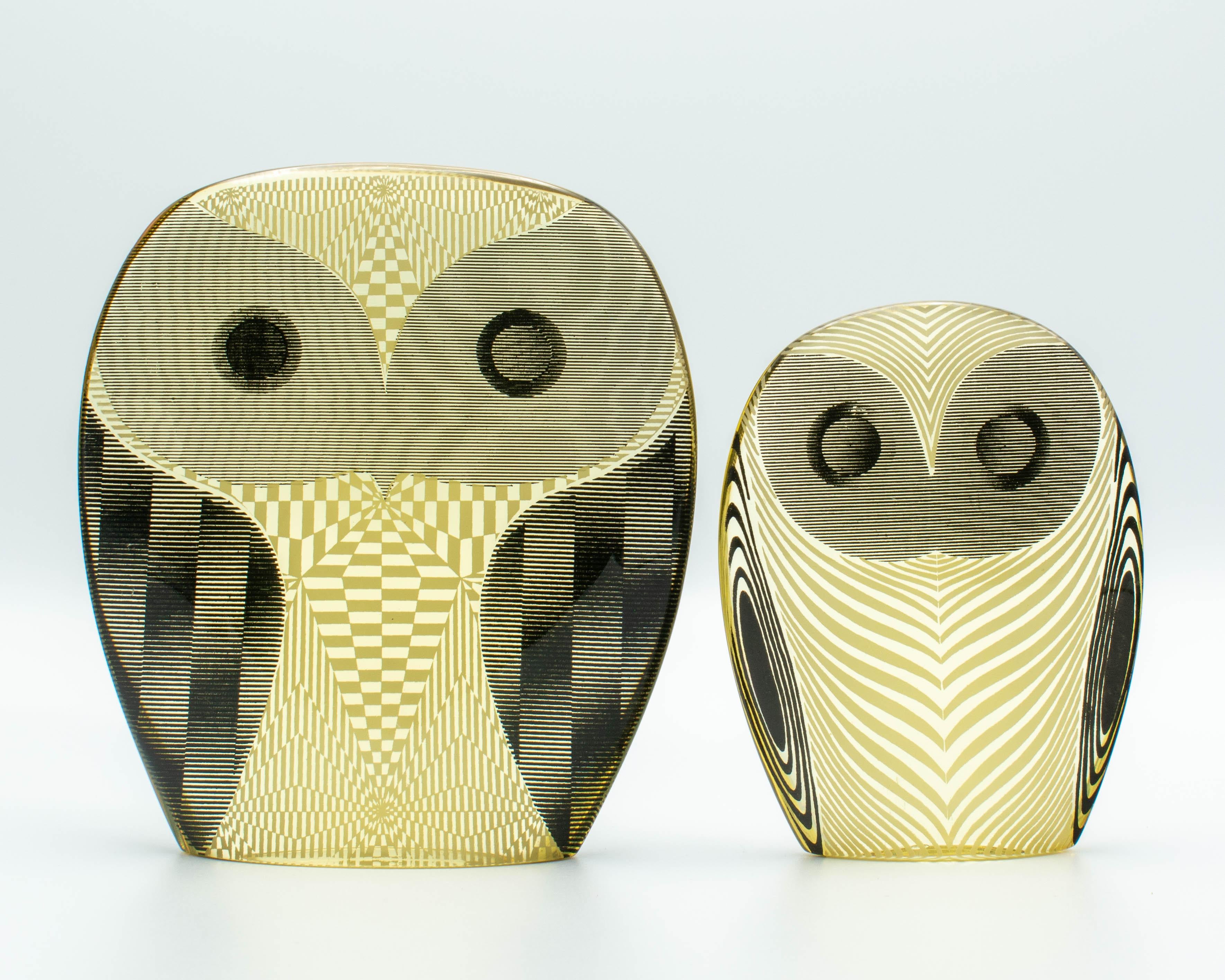 A pair of Mid-Century Modern Lucite op art owls designed by Abraham Palatnik. Remnants of original labels on bottom: Made in Brazil. Abraham Palatnik (born in 1928) is a Brazilian artist and inventor whose innovations include kinechromatic art. Part